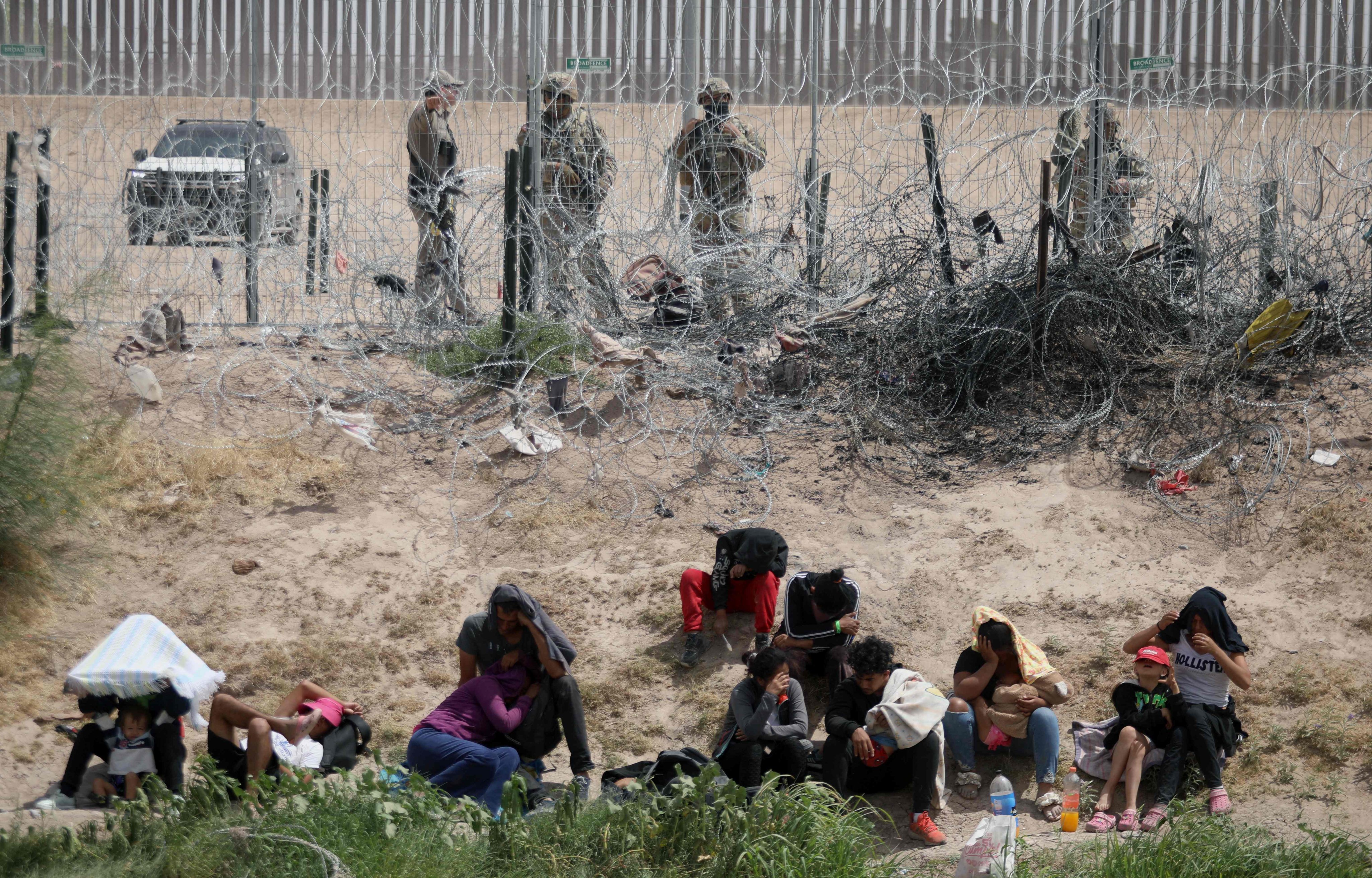 Migrants seeking asylum in the United States being watched by the Texas National Guard. File photo: AFP