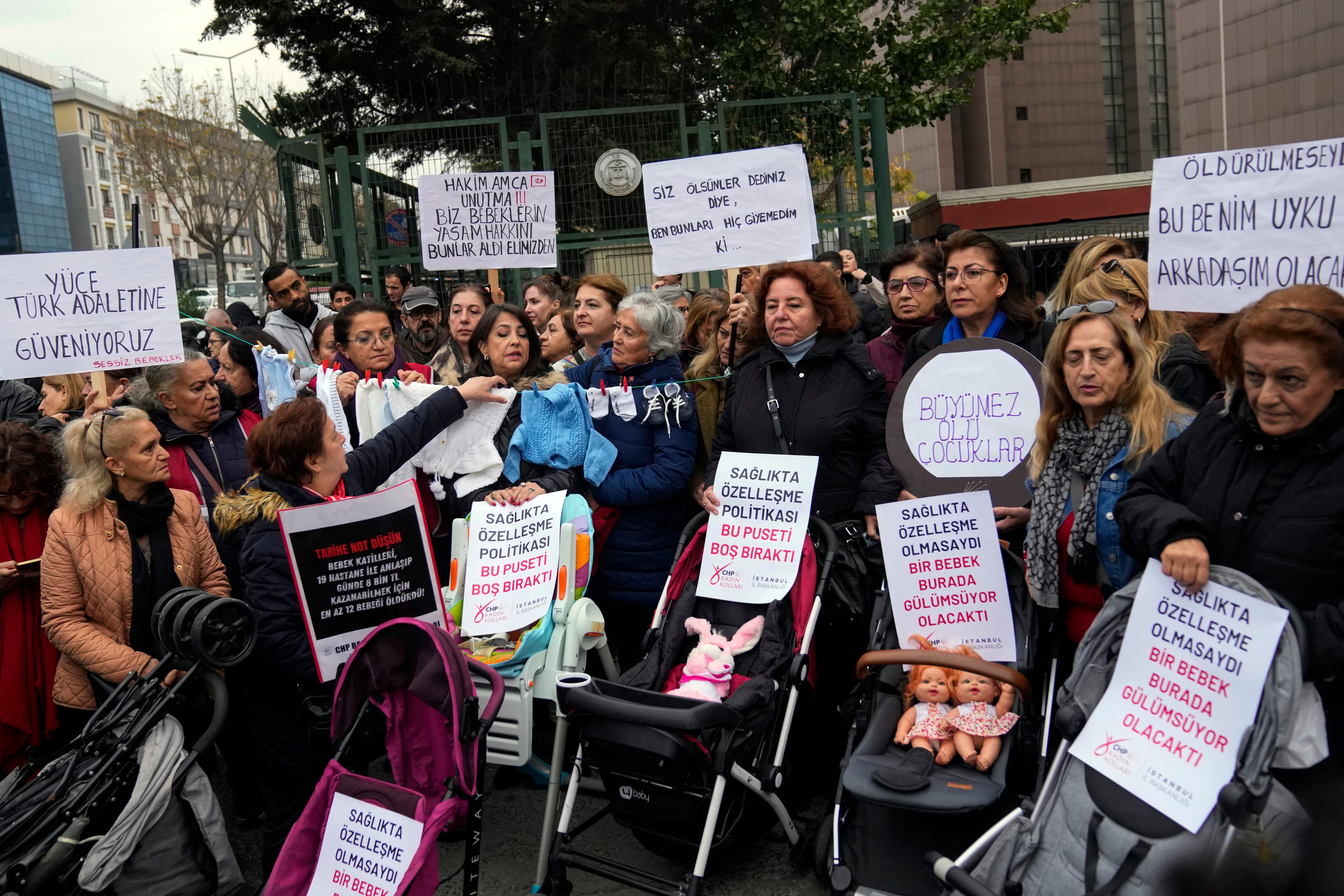 Activists protest outside the courthouse where dozens of Turkish health care workers are on trial. Photo: AP