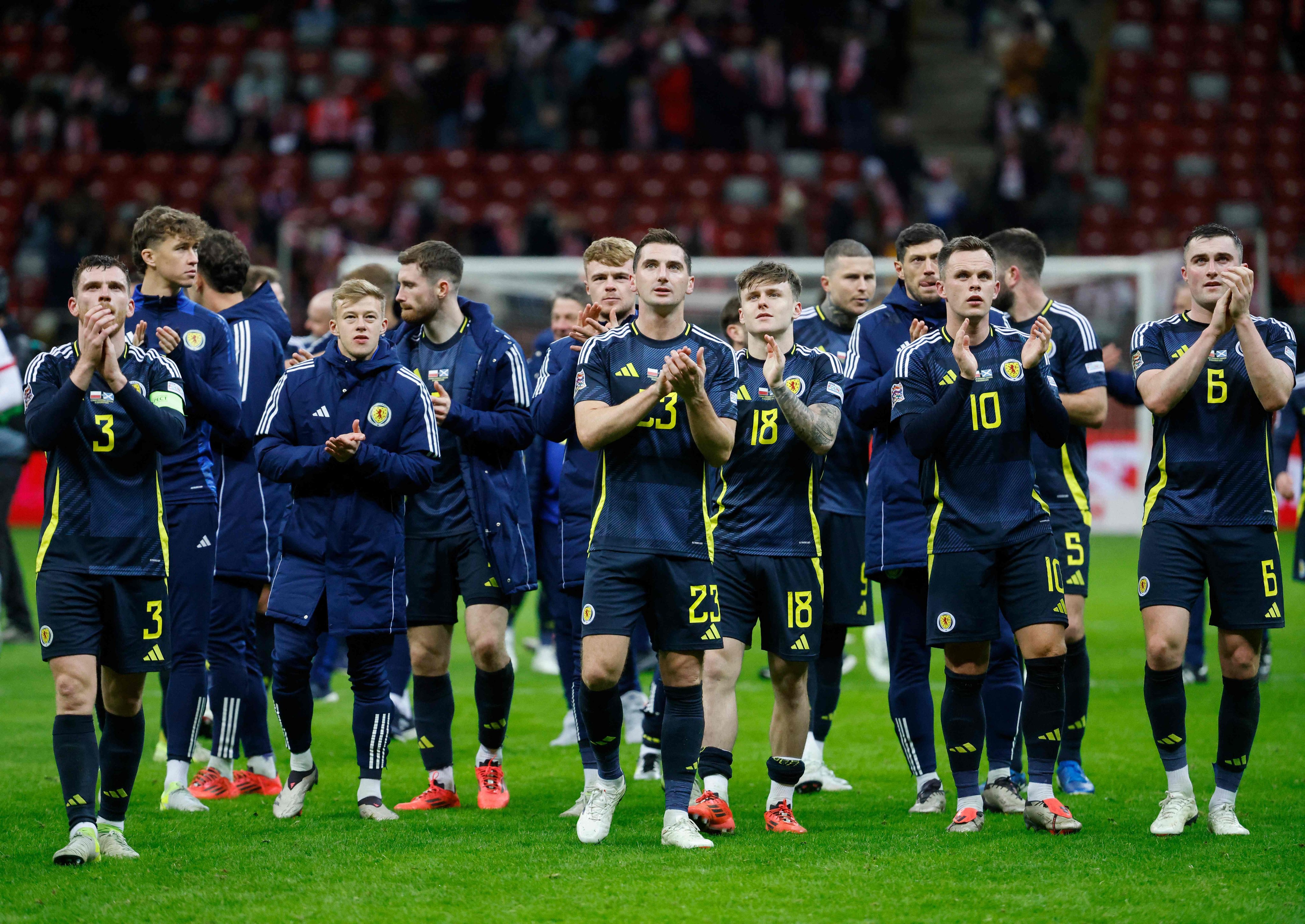 Scotland’s players celebrate as their last-gasp win in Poland gives them a League A reprieve as they now face a play-off to avoid relegation. Photo: AFP