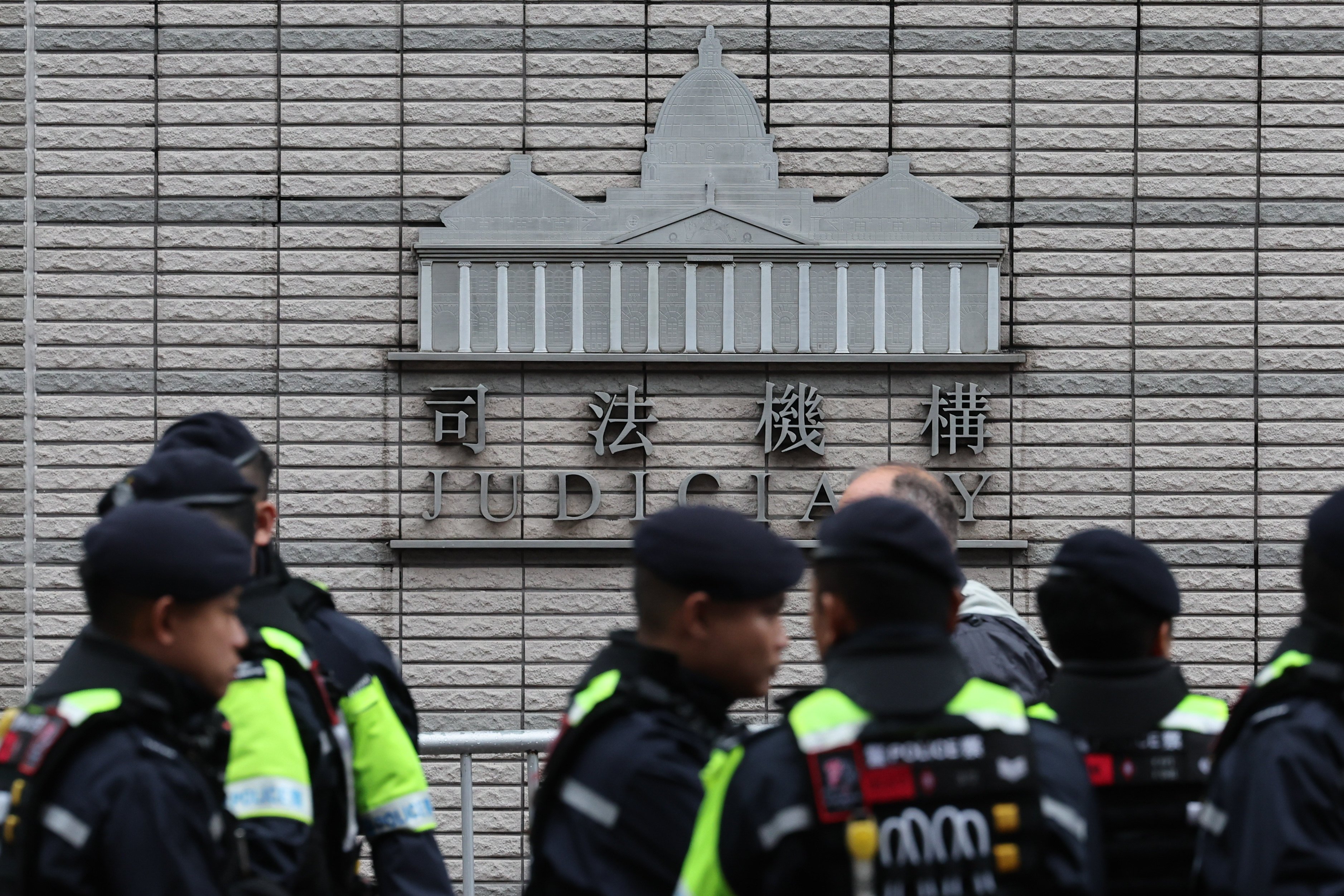 Police outside West Kowloon Court as Jimmy Lai’s trial resumes. Photo: Dickson Lee