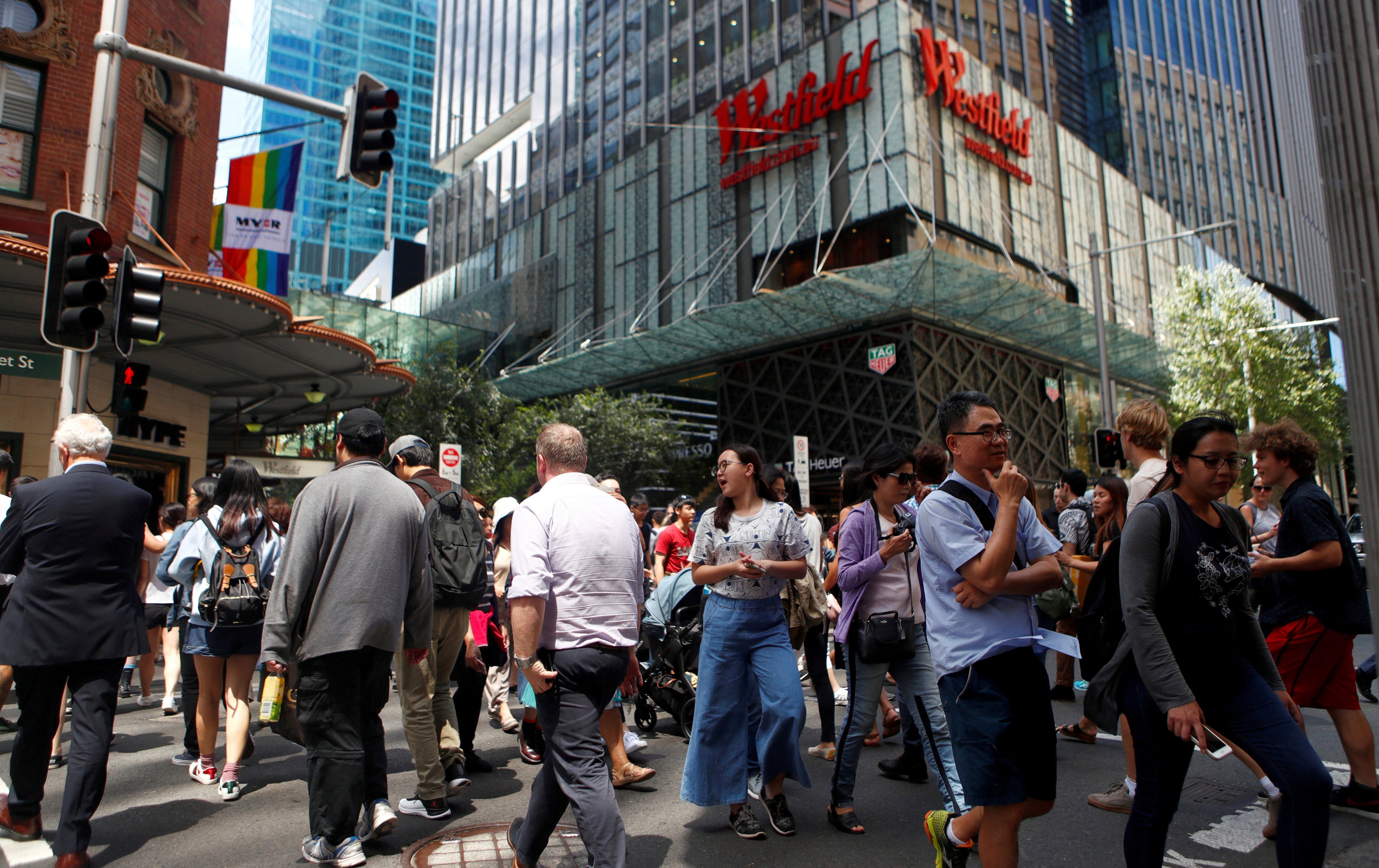 Pedestrians at Sydney’s Westfield shopping centre. A report in February showed the gender pay gap at some of Australia’s biggest firms was bigger than the national average. Photo: Reuters