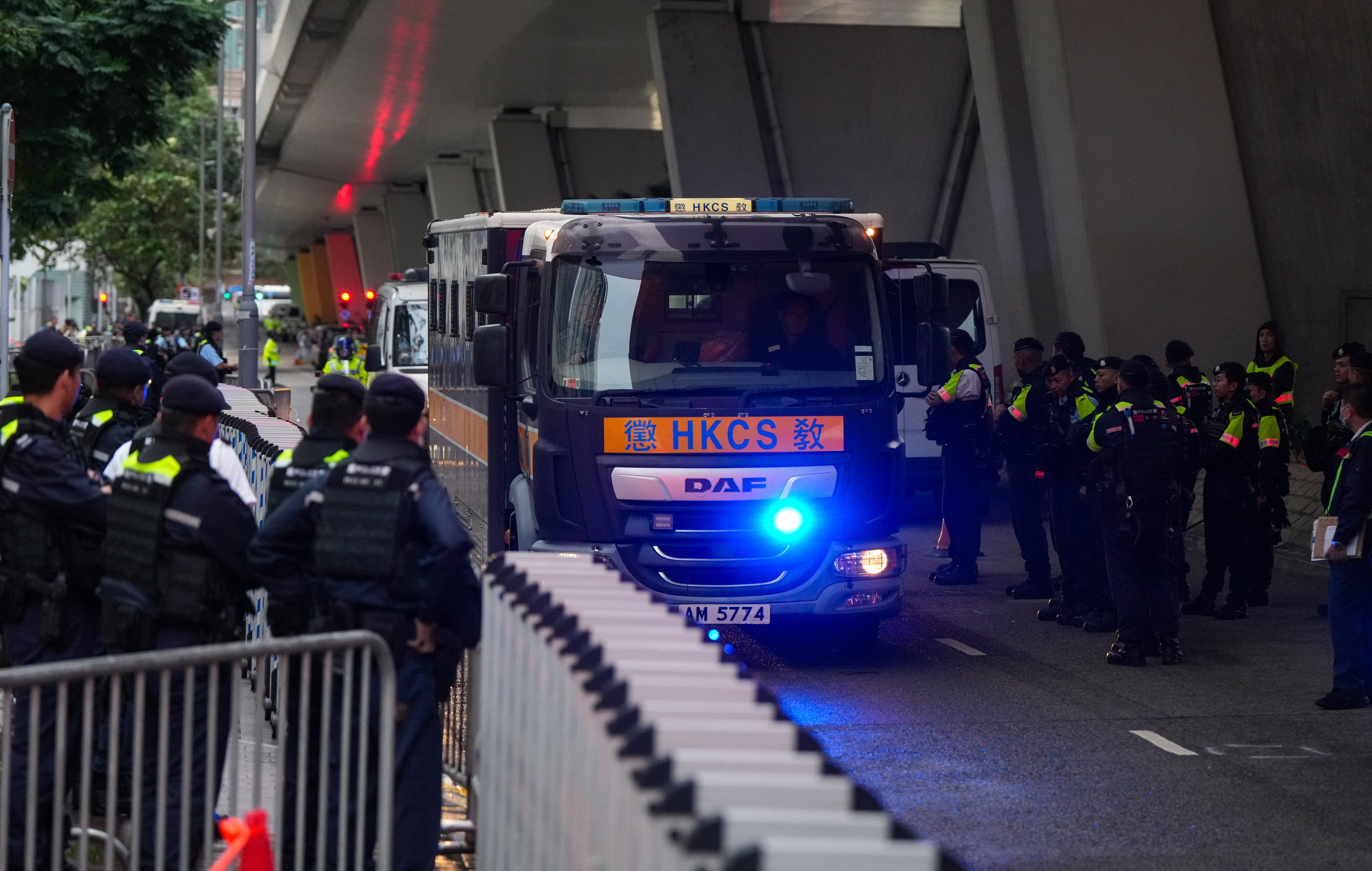 The jailed opposition activists and politicians are taken back to prison after sentencing on Monday. Photo: Sam Tsang