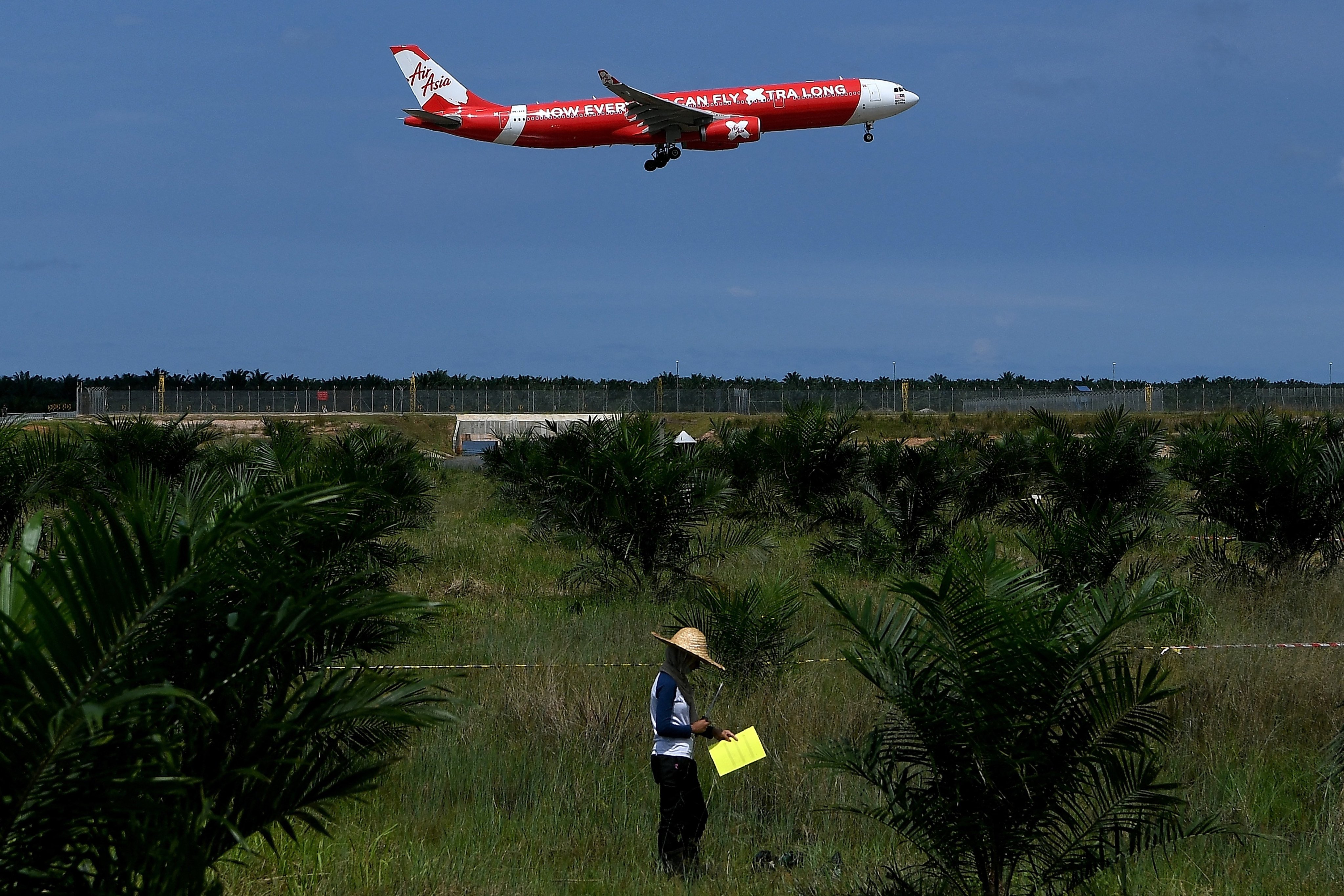 An AirAsia plane prepares to land at Kuala Lumpur International Airport, where the region’s ubiquitous budget airline is based. Photo: AFP