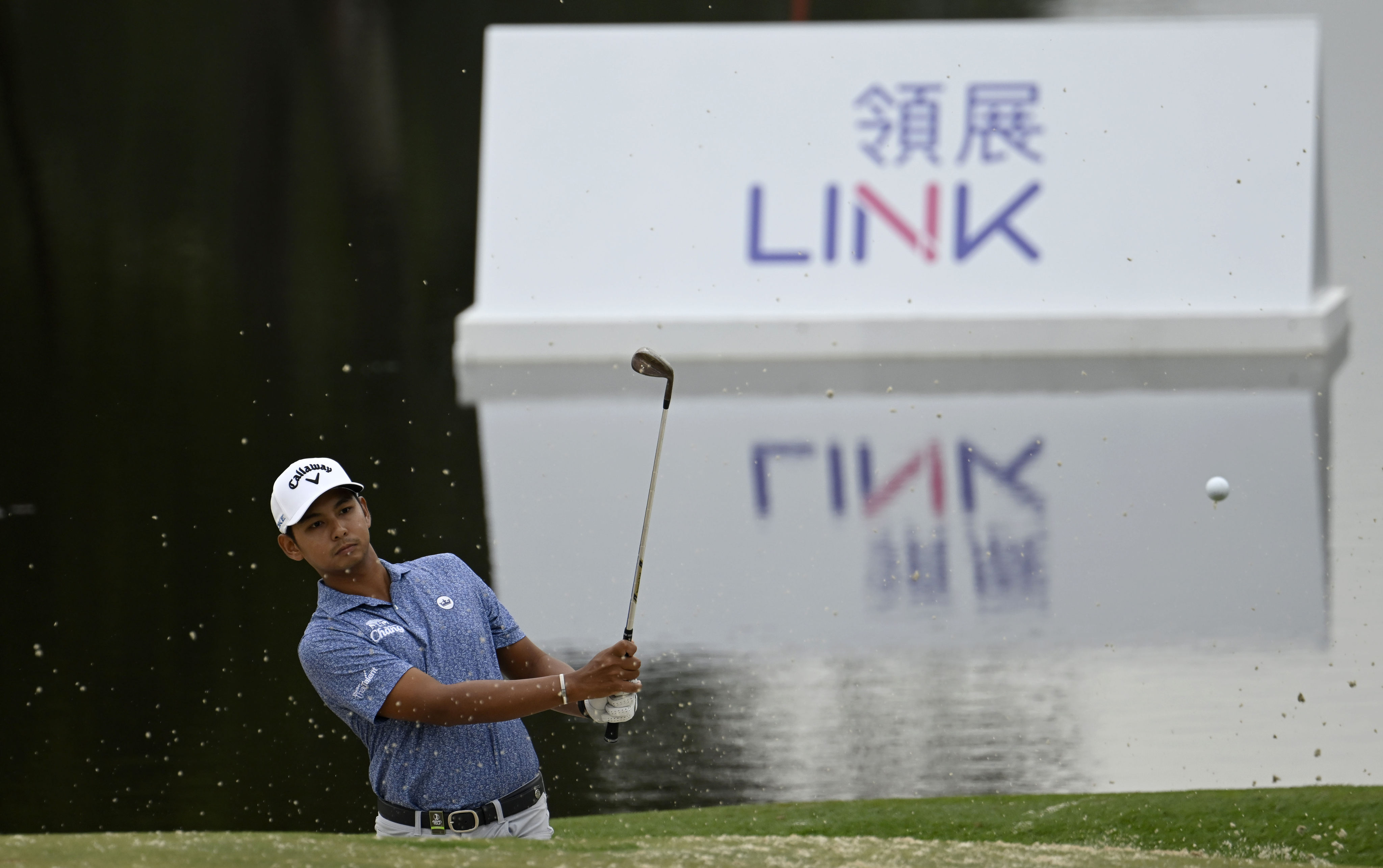 Nittihorn Thippong chips in to save par on the 18th hole during the first round of the Hong Kong Open. Photo: Asian Tour.