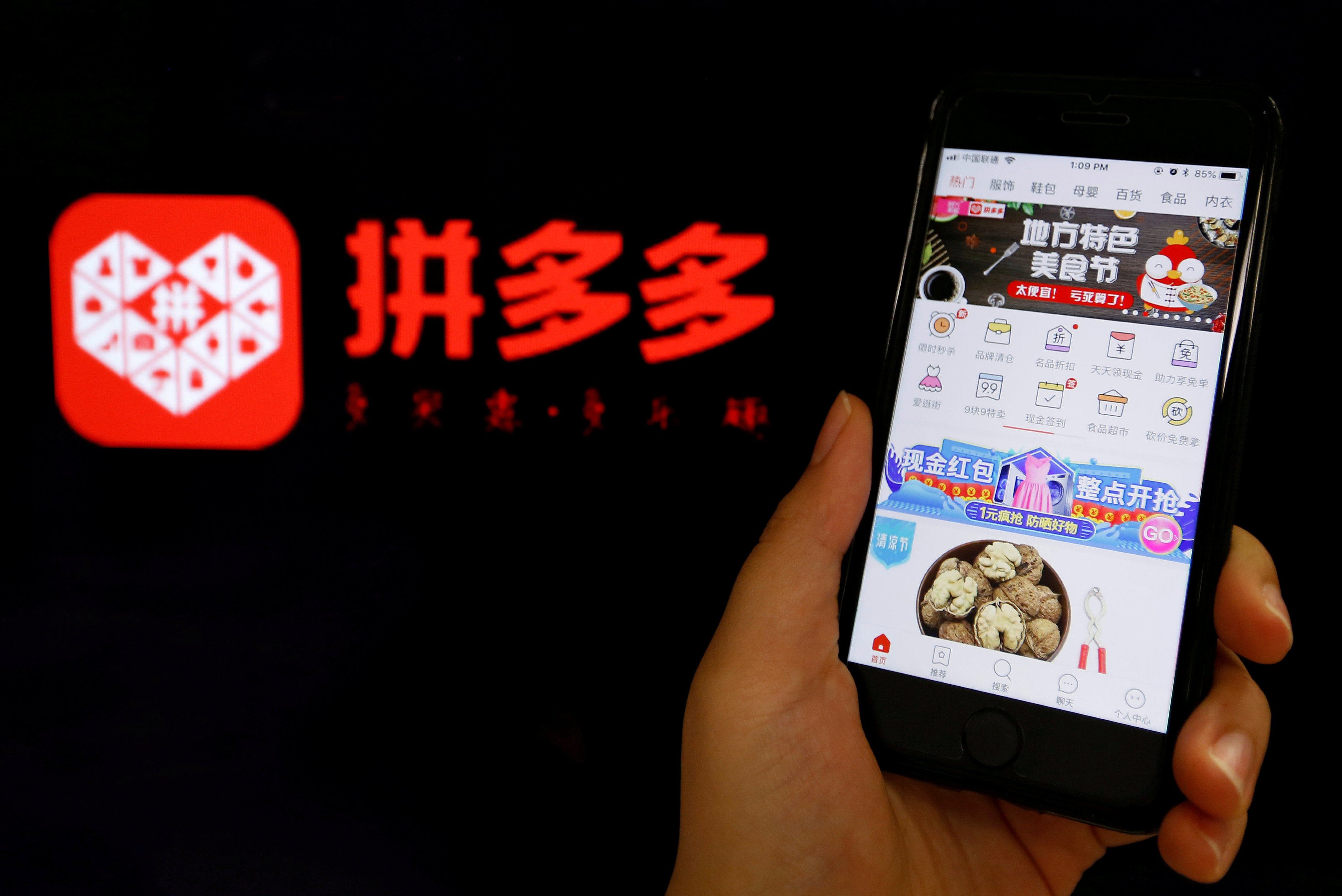 The logo of Chinese online budget shopping app Pinduoduo pictured next to its mobile app on July 17, 2018. Photo: Reuters