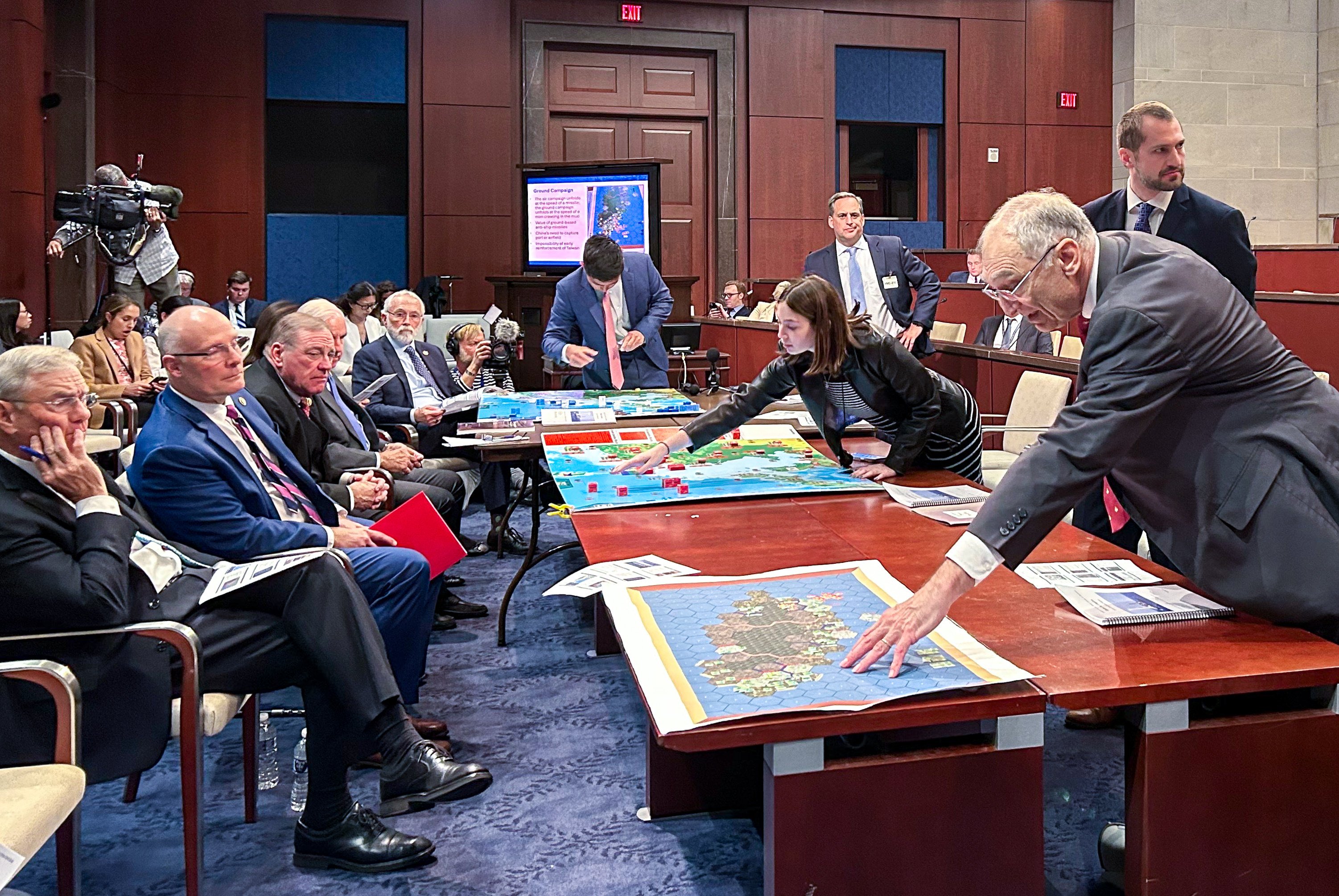 Members of the US House select committee on China taking part in an interactive simulation on the state of the US defence industrial base on Wednesday. Photo: Laura Zhou