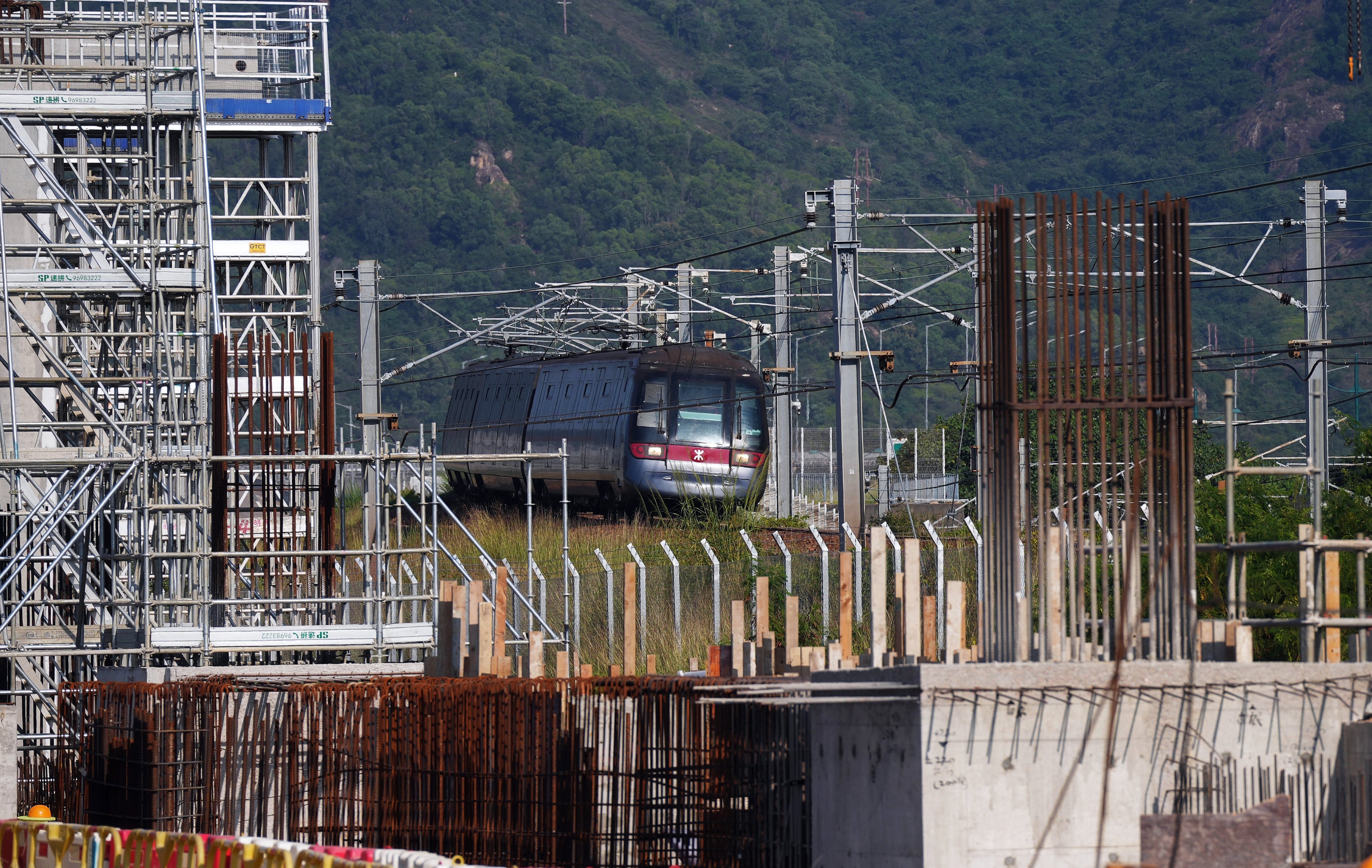 A train passes by a construction site of MTR Corporation’s extension of the Tung Chung Line on Lantau Island on October 22, 2024. Photo: Elson Li