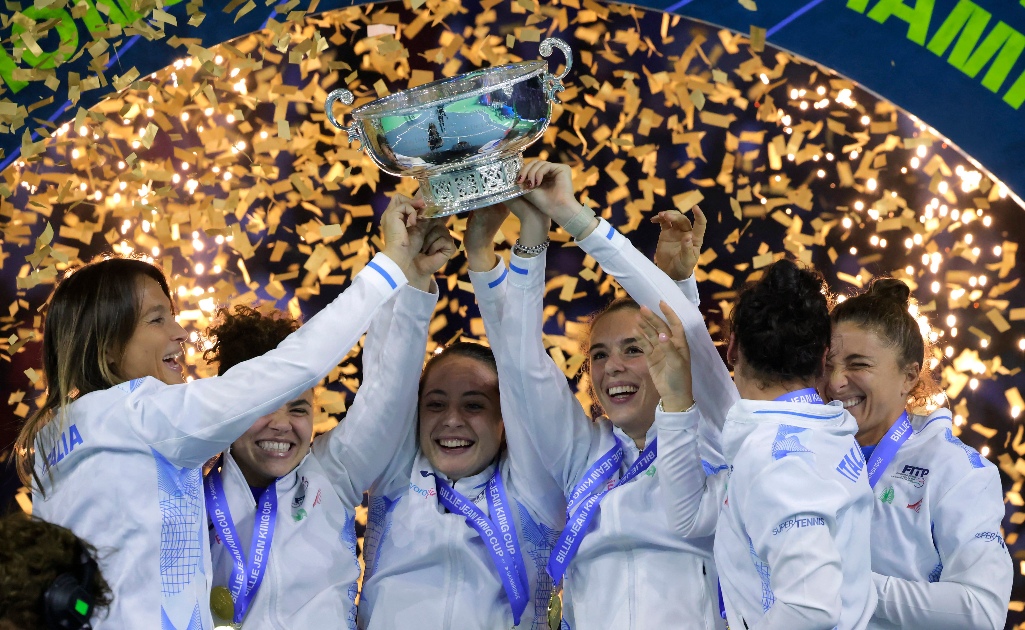 Italy’s players celebrate after winning the BJK Cup with victory over Slovakia in the final. Photo: Reuters