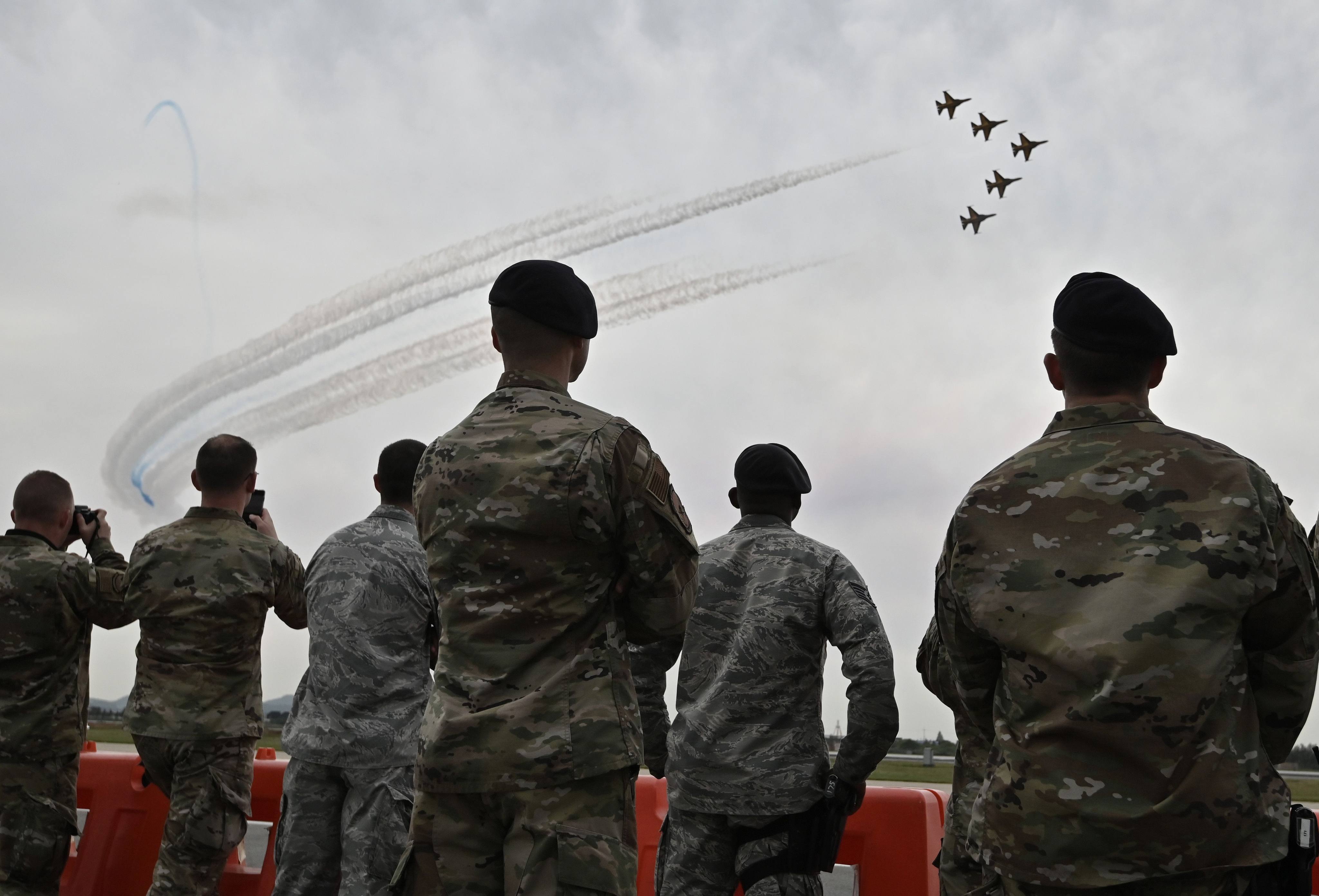 US soldiers watch an aerobatic performance in Pyeongtaek. A South Korean teenager’s jaw was broken in an assault by an American sergeant last week. Photo: AFP
