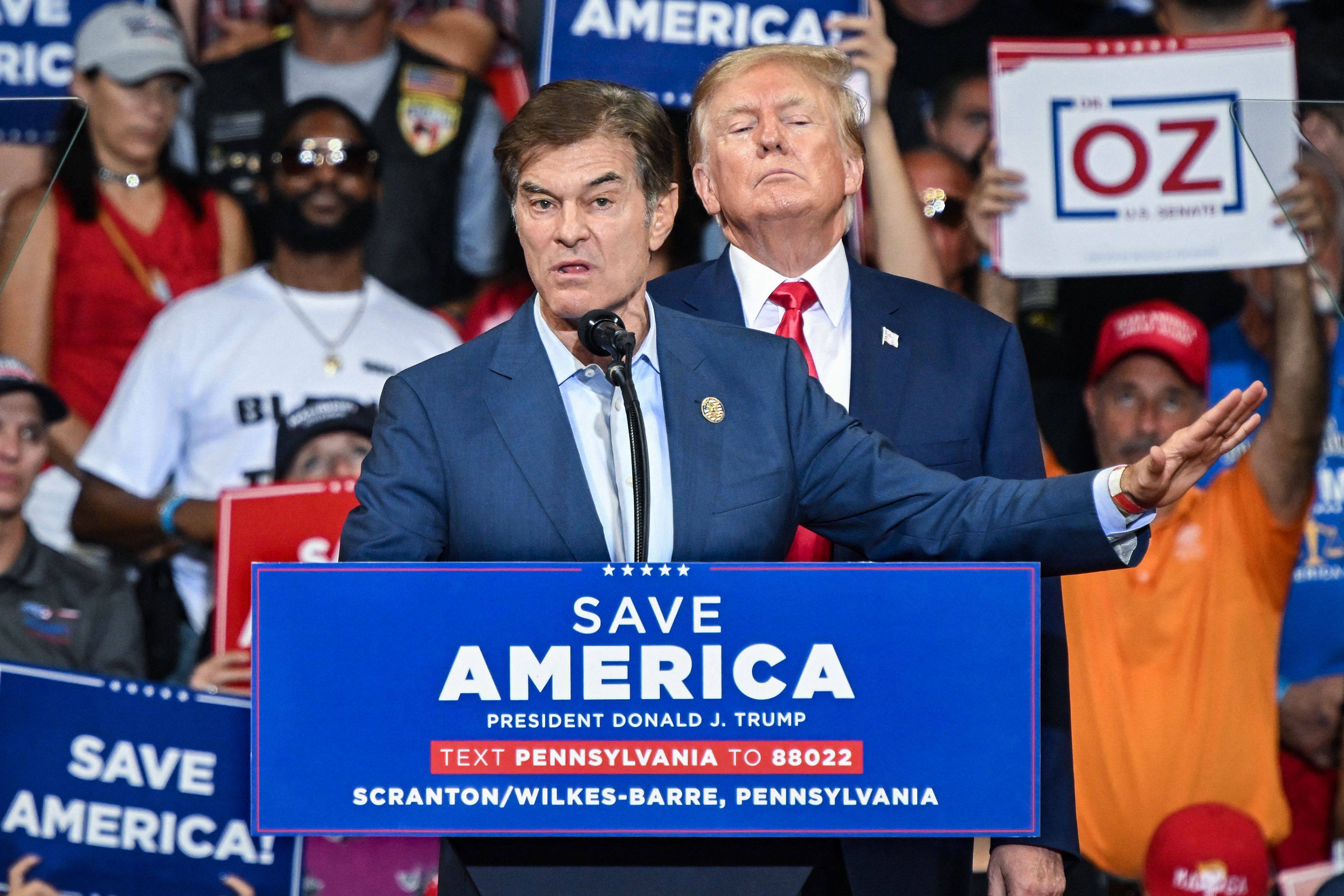 Mehmet Oz speaks as Donald Trump stands behind him during a campaign rally in Wilkes-Barre, Pennsylvania, in September 2022. Photo: AFP