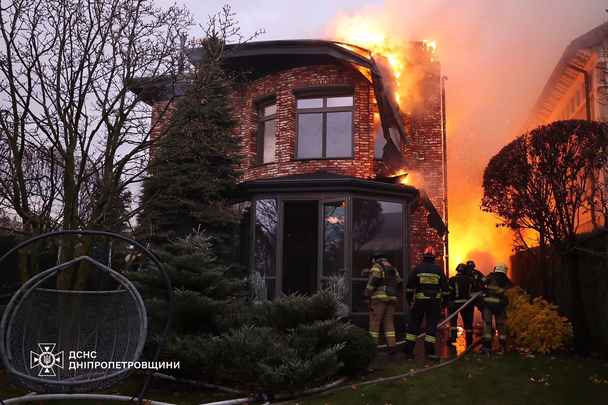 Ukrainian rescuers work at the site of the rocket strike in Dnipro. Photo: EPA-EFE