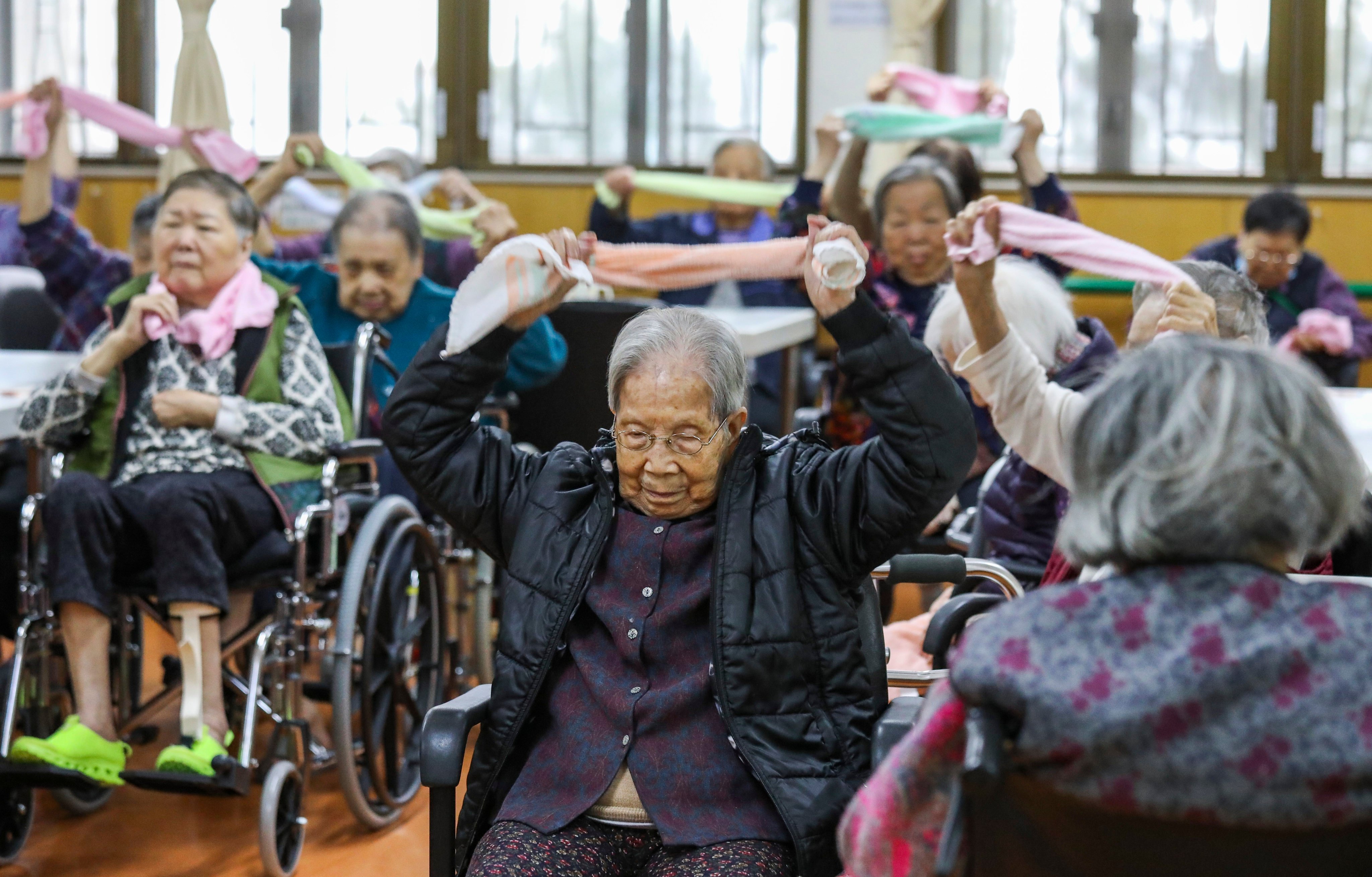 Seniors attend an exercise session in an elderly care home in Pok Fu Lam. Photo: Dickson Lee