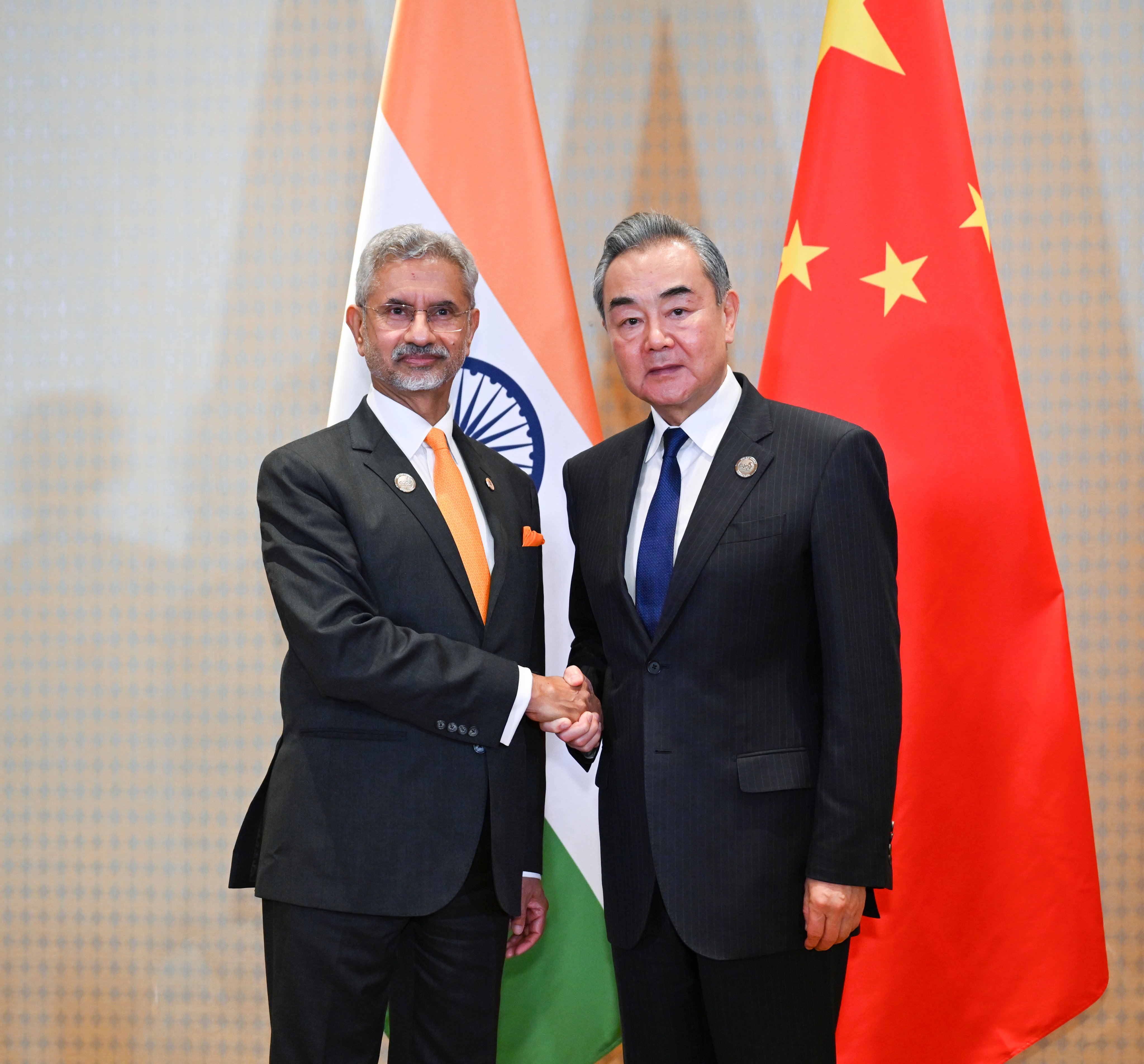 Chinese Foreign Minister Wang Yi shakes hands with his Indian counterpart S. Jaishankar in Brazil, on Monday. Photo: Xinhua