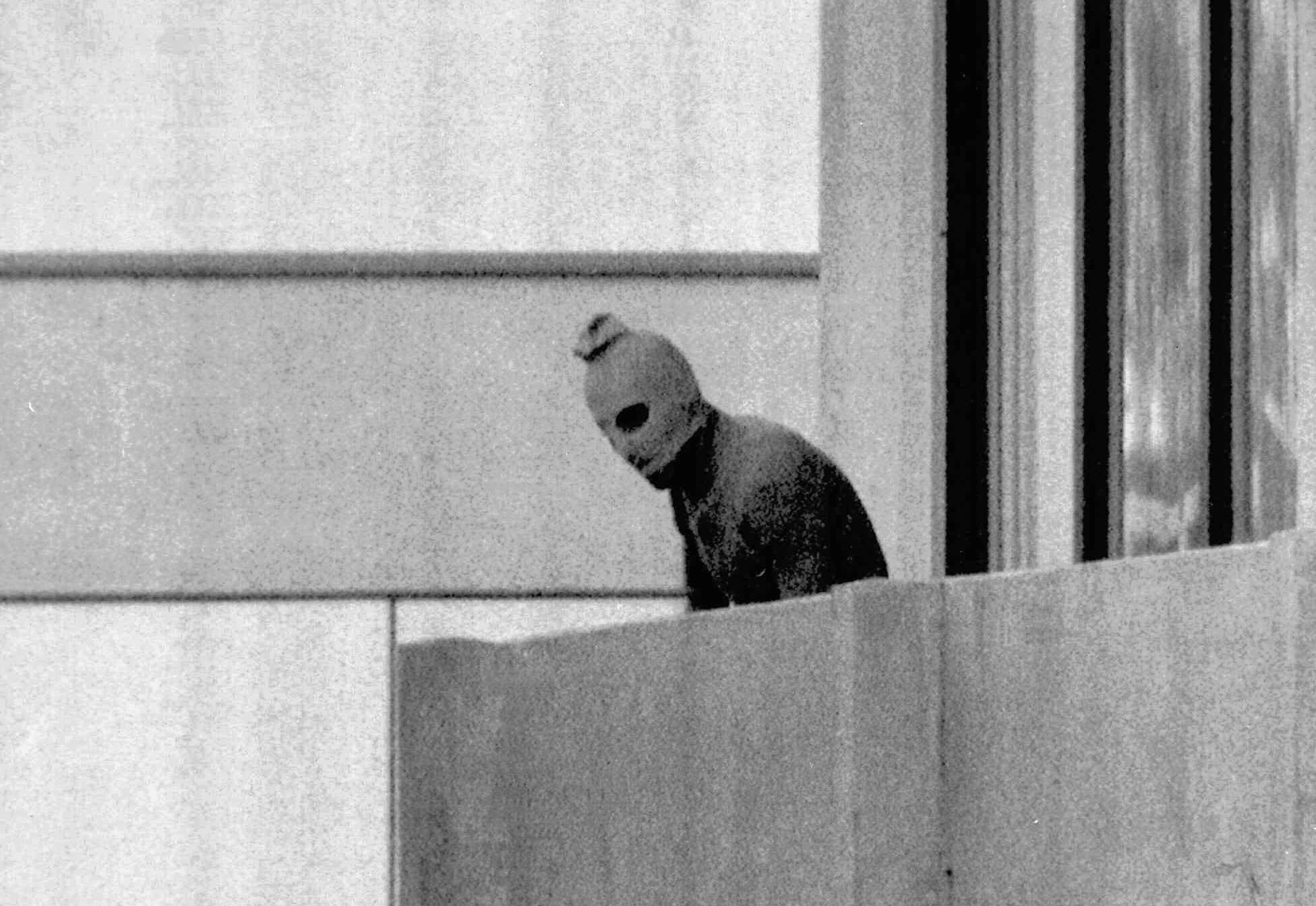 A Palestinian terrorist on a balcony at the Olympic Village in Munich where his group held Israeli athletes hostage. The Black September attack in 1972 is the subject of new thriller September 5. Photo: AP 