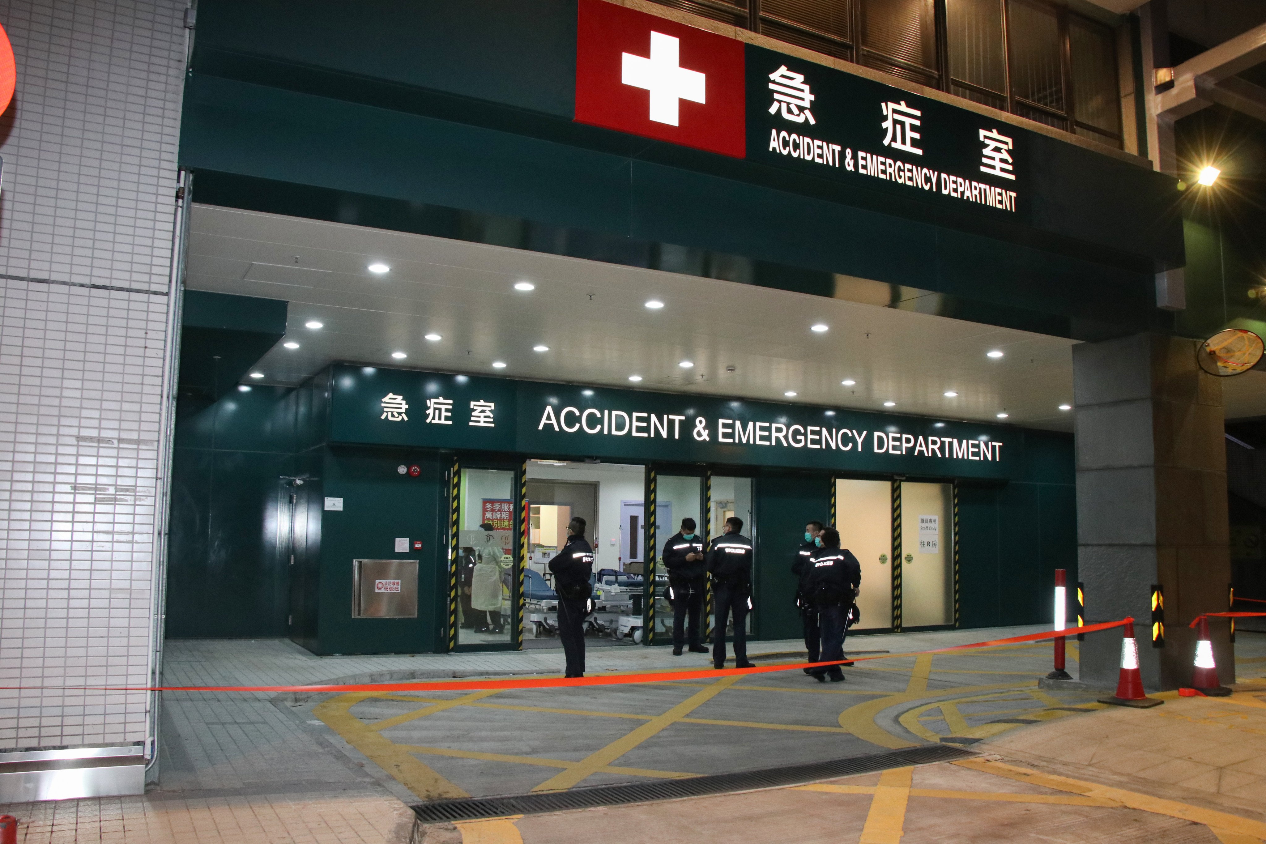 Police officers at Caritas Medical Centre in Cheung Sha Wan after a smoke bomb detonated inside a male toilet in the emergency department on January 27, 2020. Photo: Handout