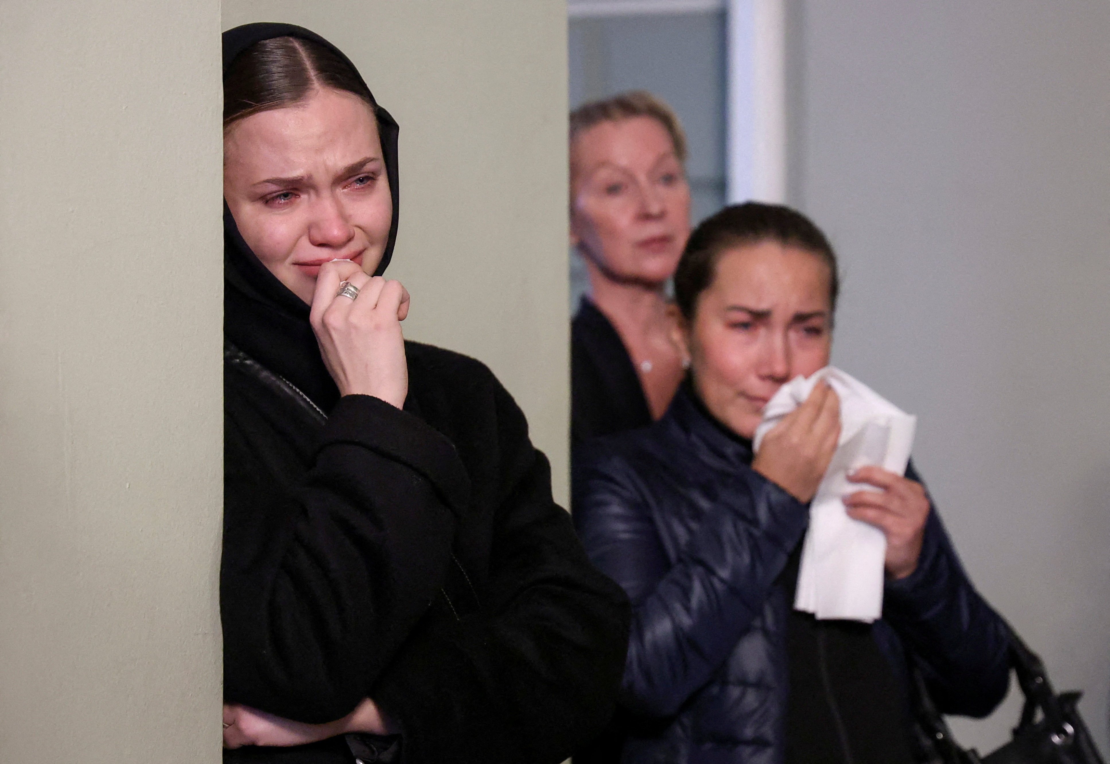 Mourners attend a farewell service before the funeral of Vladimir Shklyarov in St Petersburg, Russia. Photo: Reuters