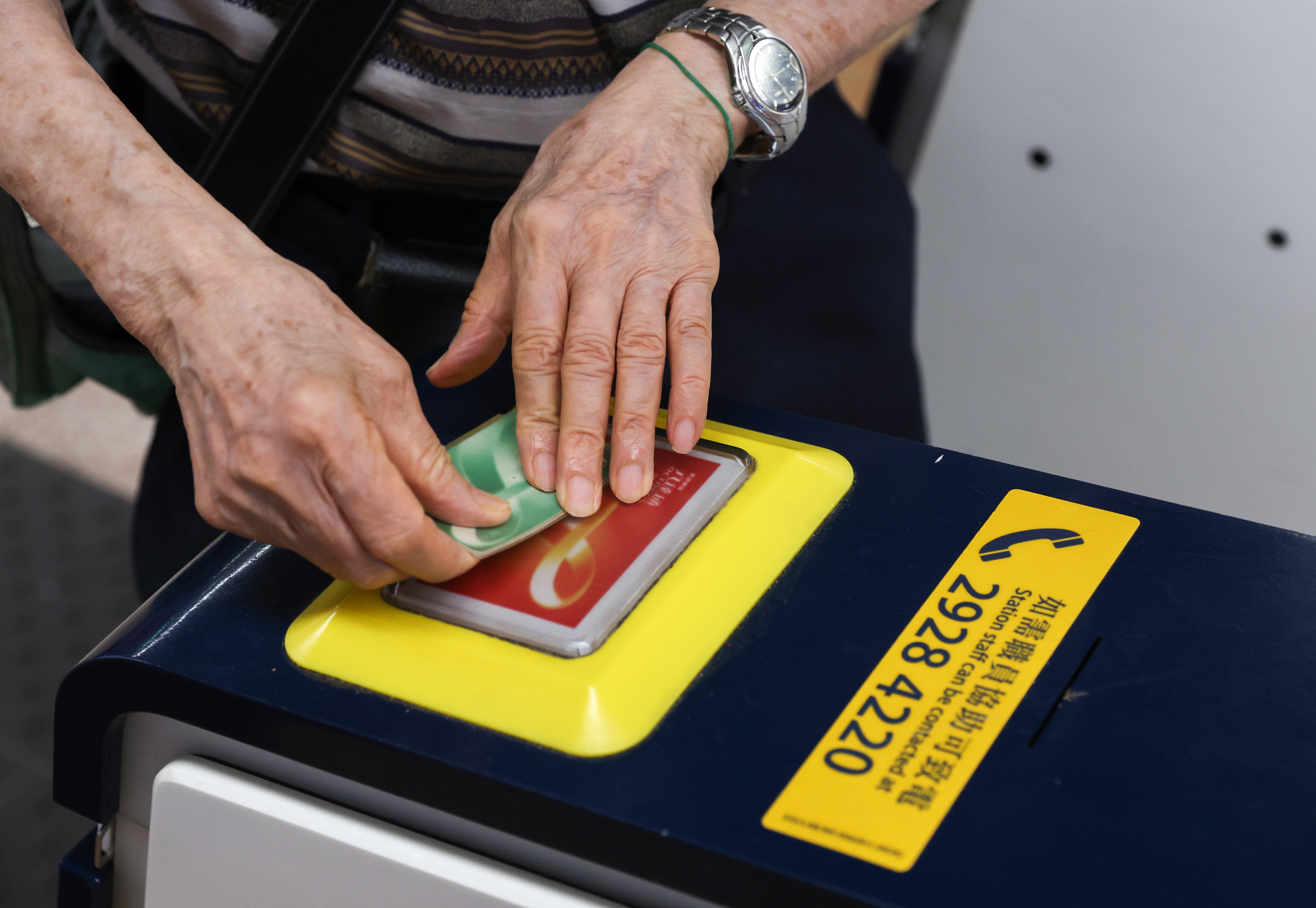 An elderly passenger taps their transport card at Mong Kok MTR Station. The government’s HK$2 fare subsidy scheme for elderly and disabled passengers is up for review. Photo: Yik Yeung-man