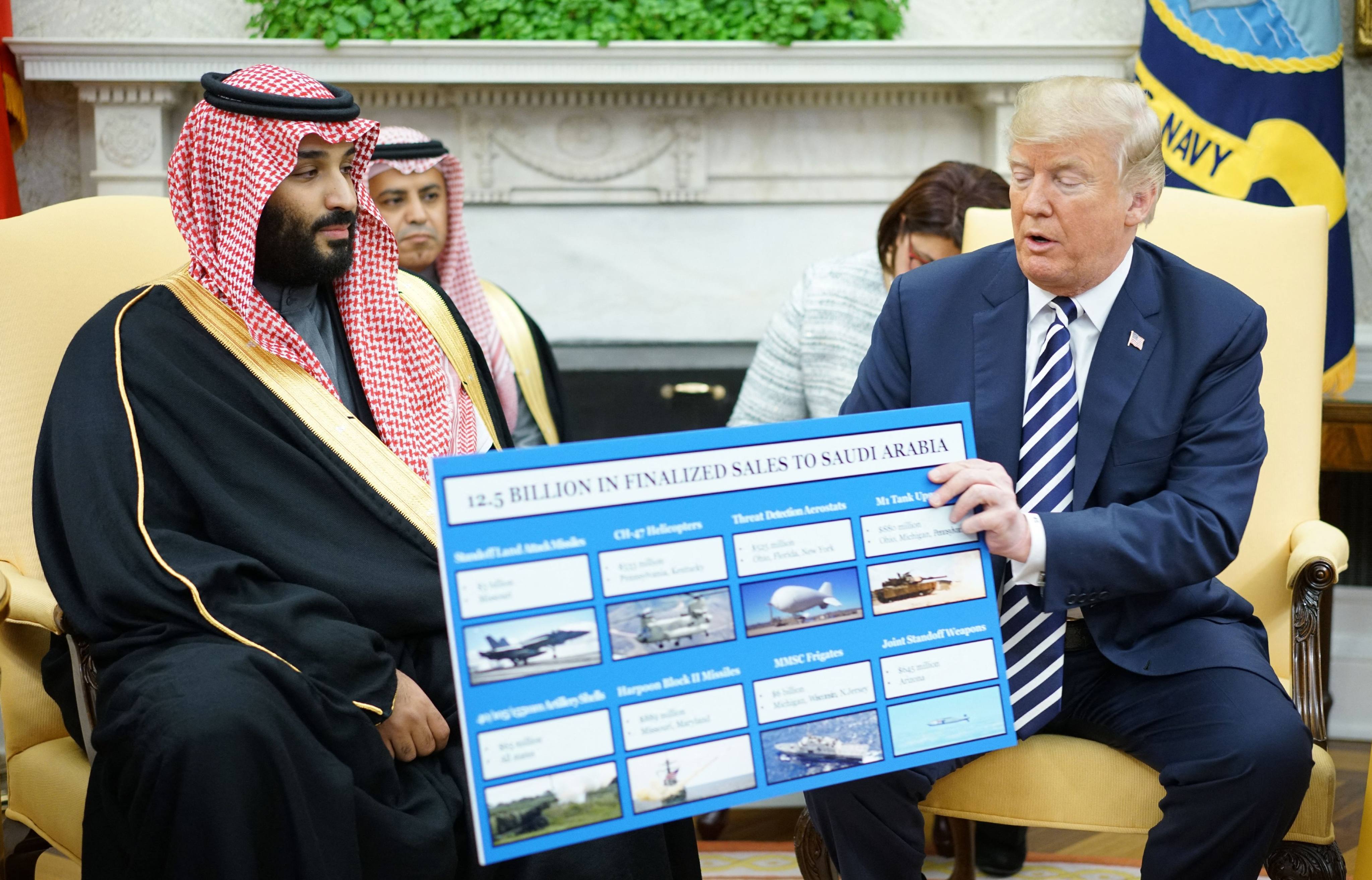 Then-US president Donald Trump holds a chart showing defence sales next to Saudi Arabian Crown Prince Mohammed bin Salman in Washington, on March 20, 2018. Photo: AFP