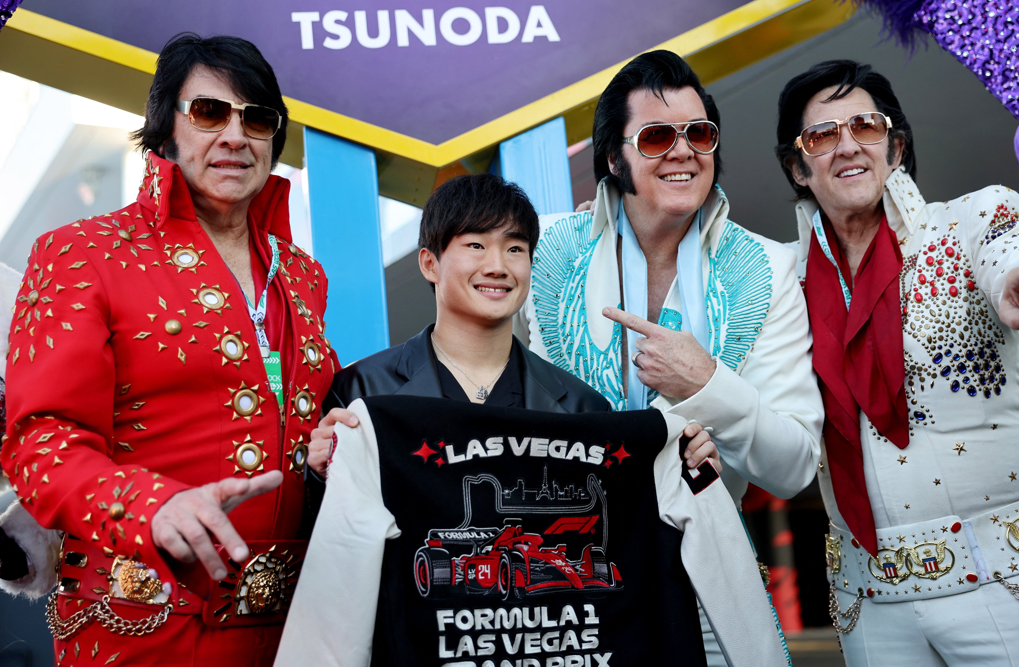 RB’s Yuki Tsunoda with performers dressed as Elvis Presley before practice in Las Vegas. Tsunoda had flown in ahead of his team for a promotional event. Photo: Reuters