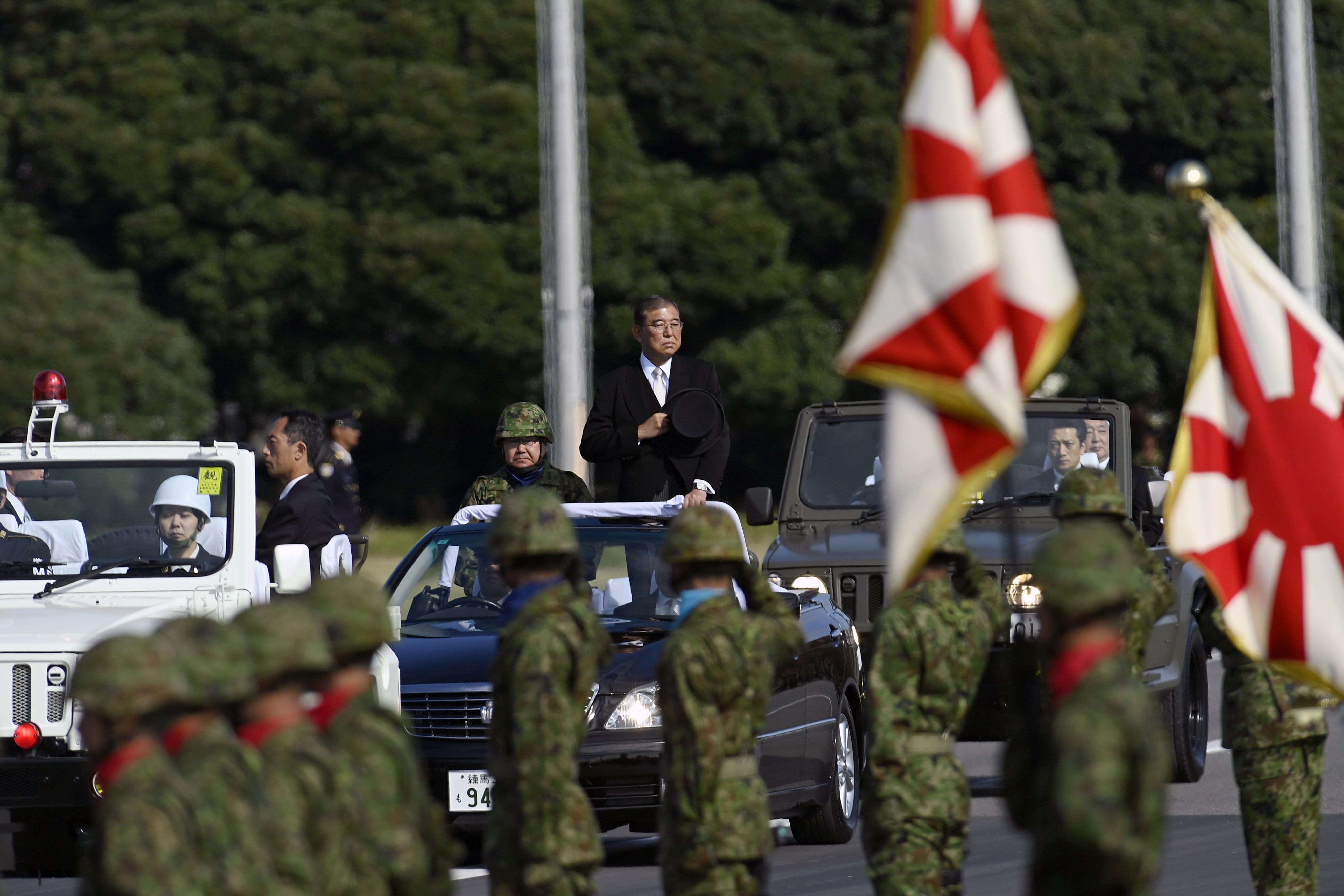 Japanese Prime Minister Shigeru Ishiba reviews the troops at a military base in Asaka, Japan, on November 9. Photo: EPA-EFE