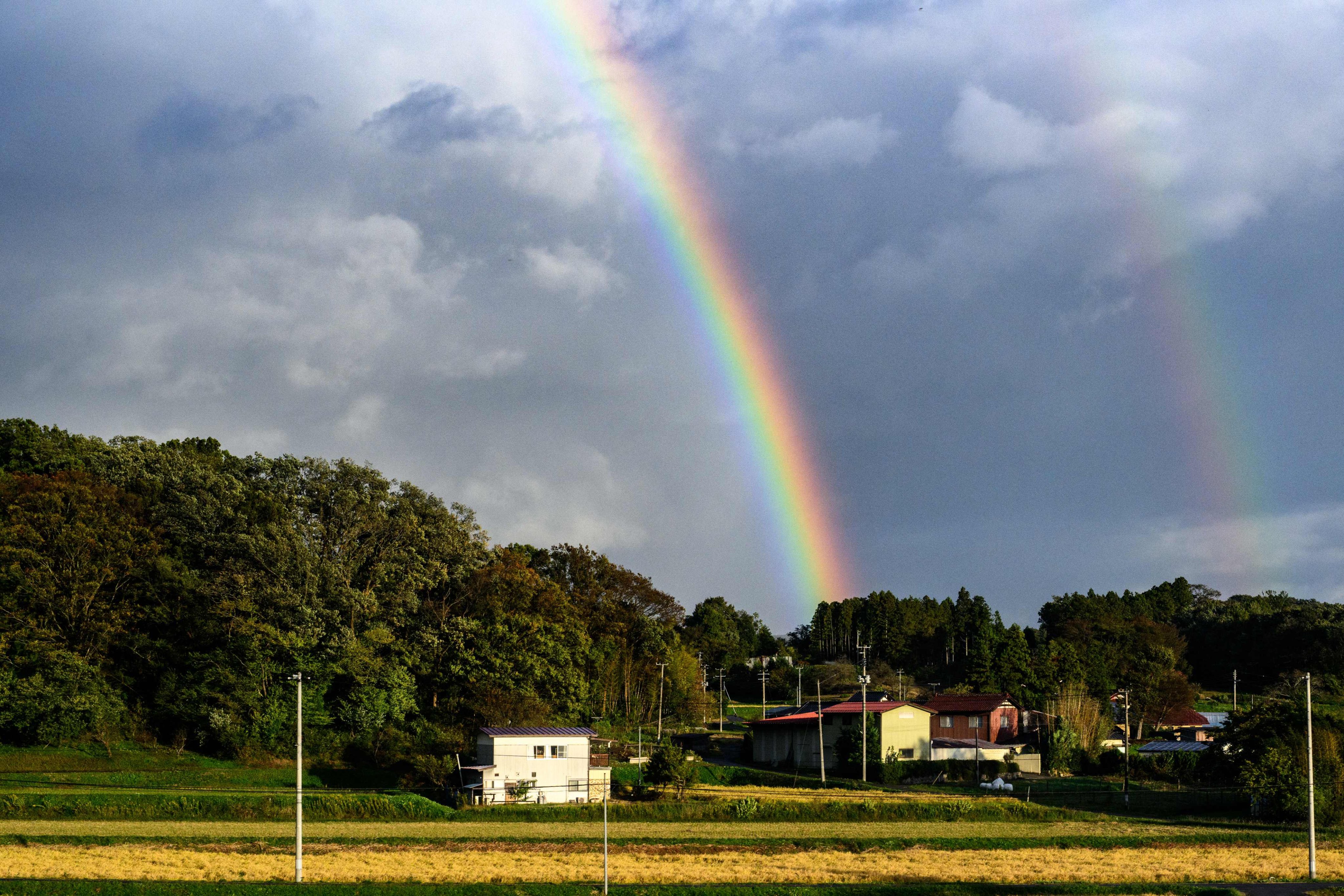 A rainbow is seen through a Tohoku Shinkansen train window, near Koriyama station in Fukushima on October 30. Photo: AFP