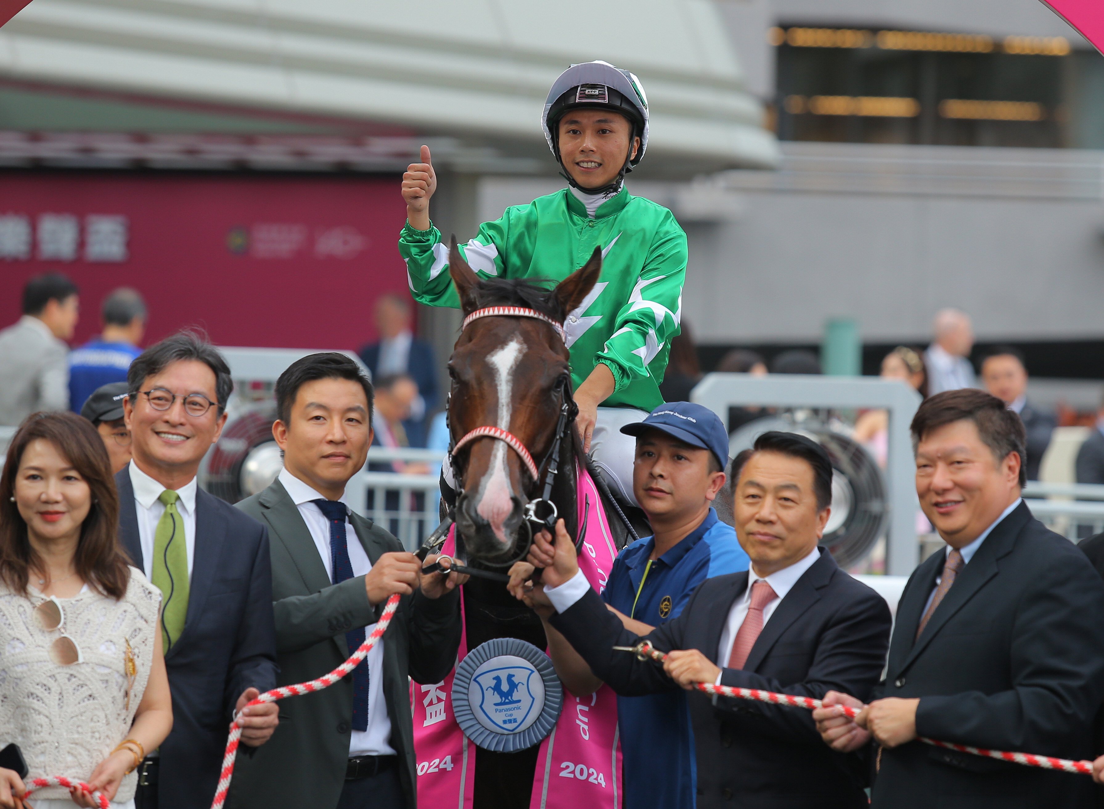 Jockey Matthew Poon and connections of Green N White celebrate his Panasonic Cup win. Photos: Kenneth Chan