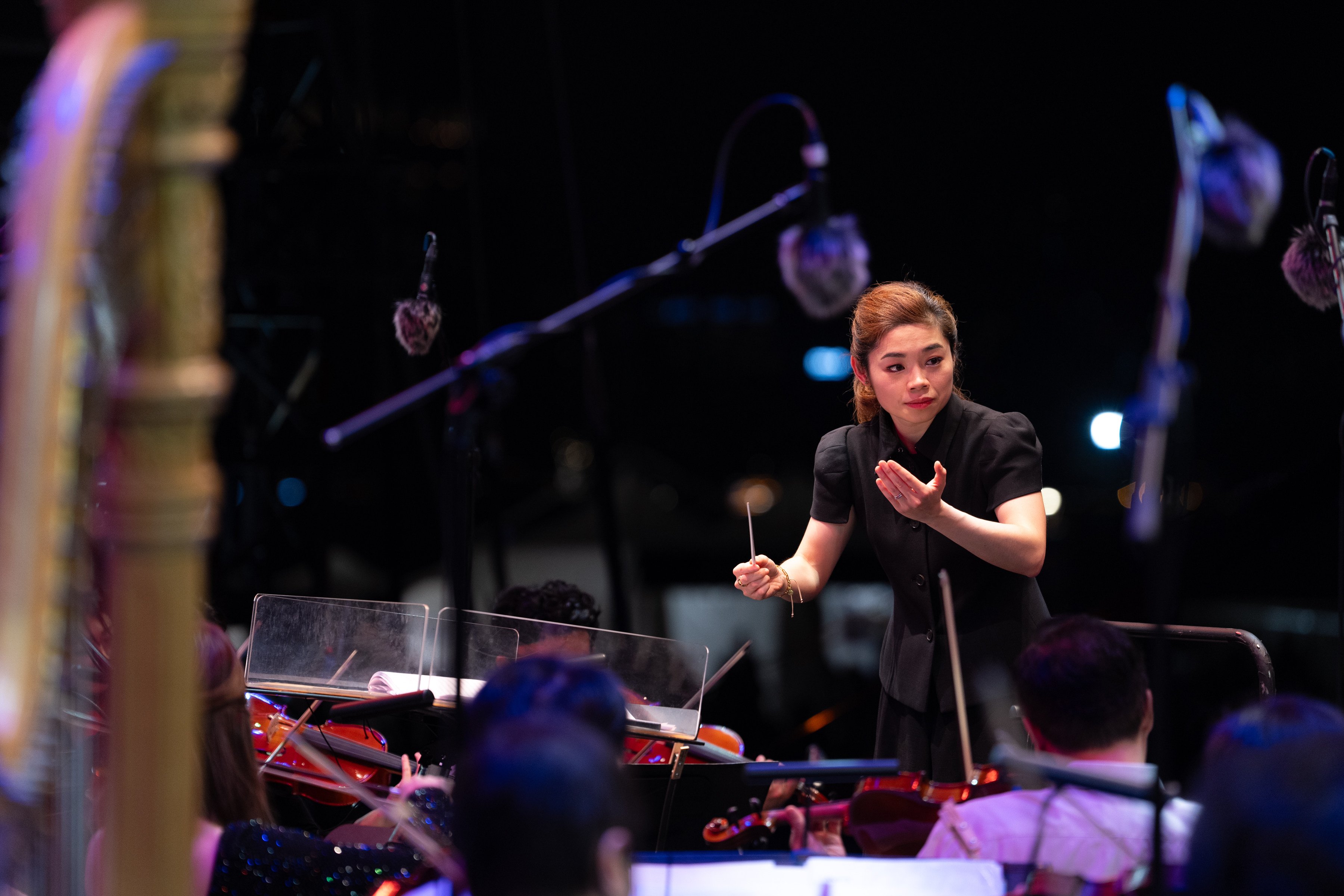 Elim Chan conducts the Hong Kong Philharmonic Orchestra in a Symphony Under The Stars concert in November 2024. Photo: Desmond Chan/Hong Kong Philharmonic Orchestra