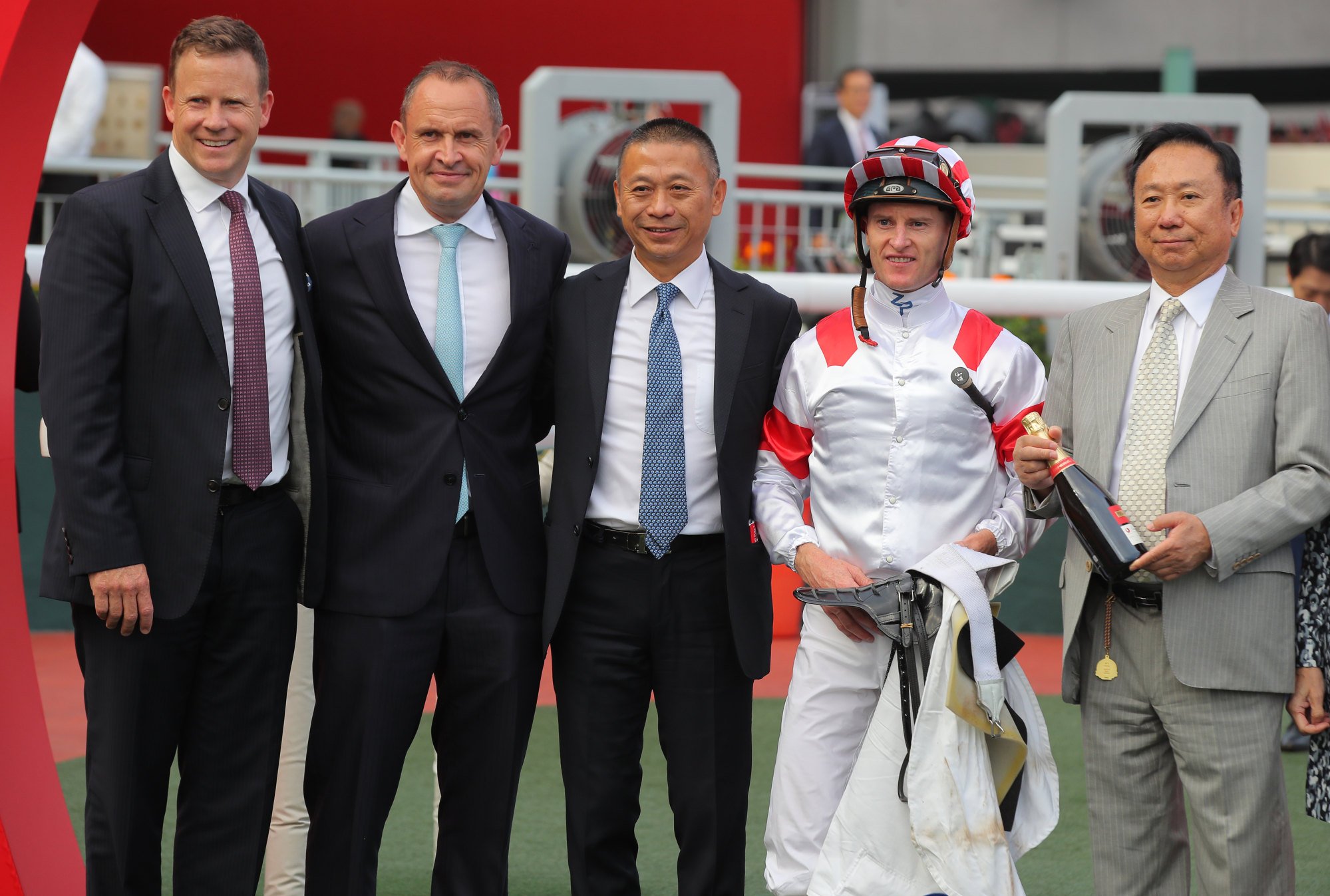 Chris Waller (second from left), Danny Shum (centre), jockey Zac Purton and owner Boniface Ho (right) celebrate Charming Legend’s win.