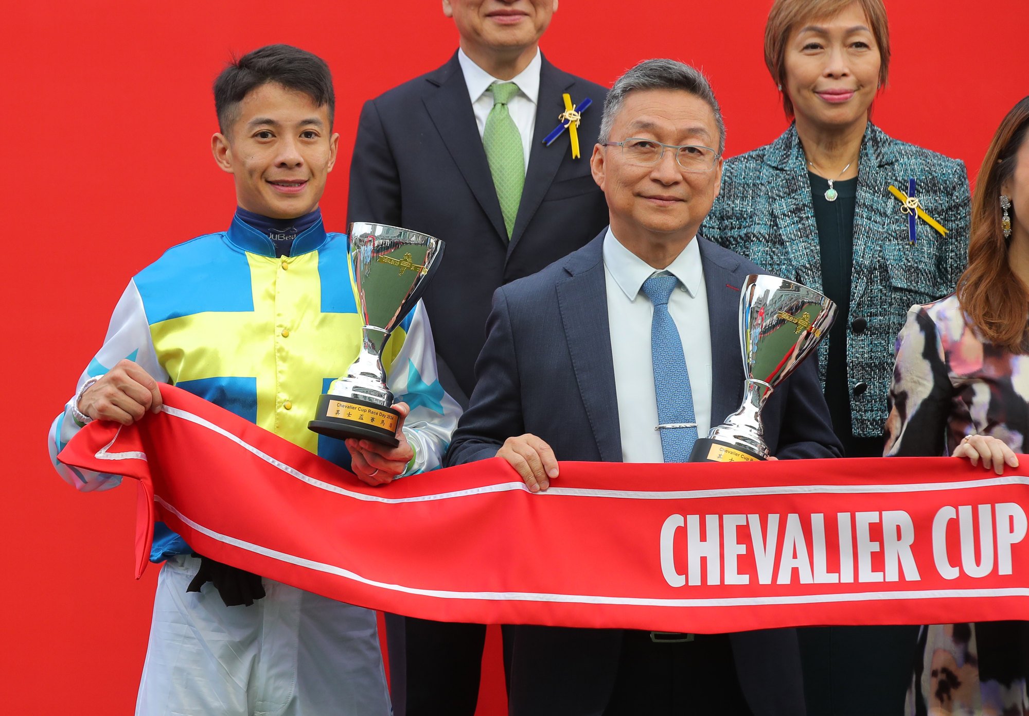 Jockey Derek Leung and trainer Francis Lui with the Chevalier Cup trophies.