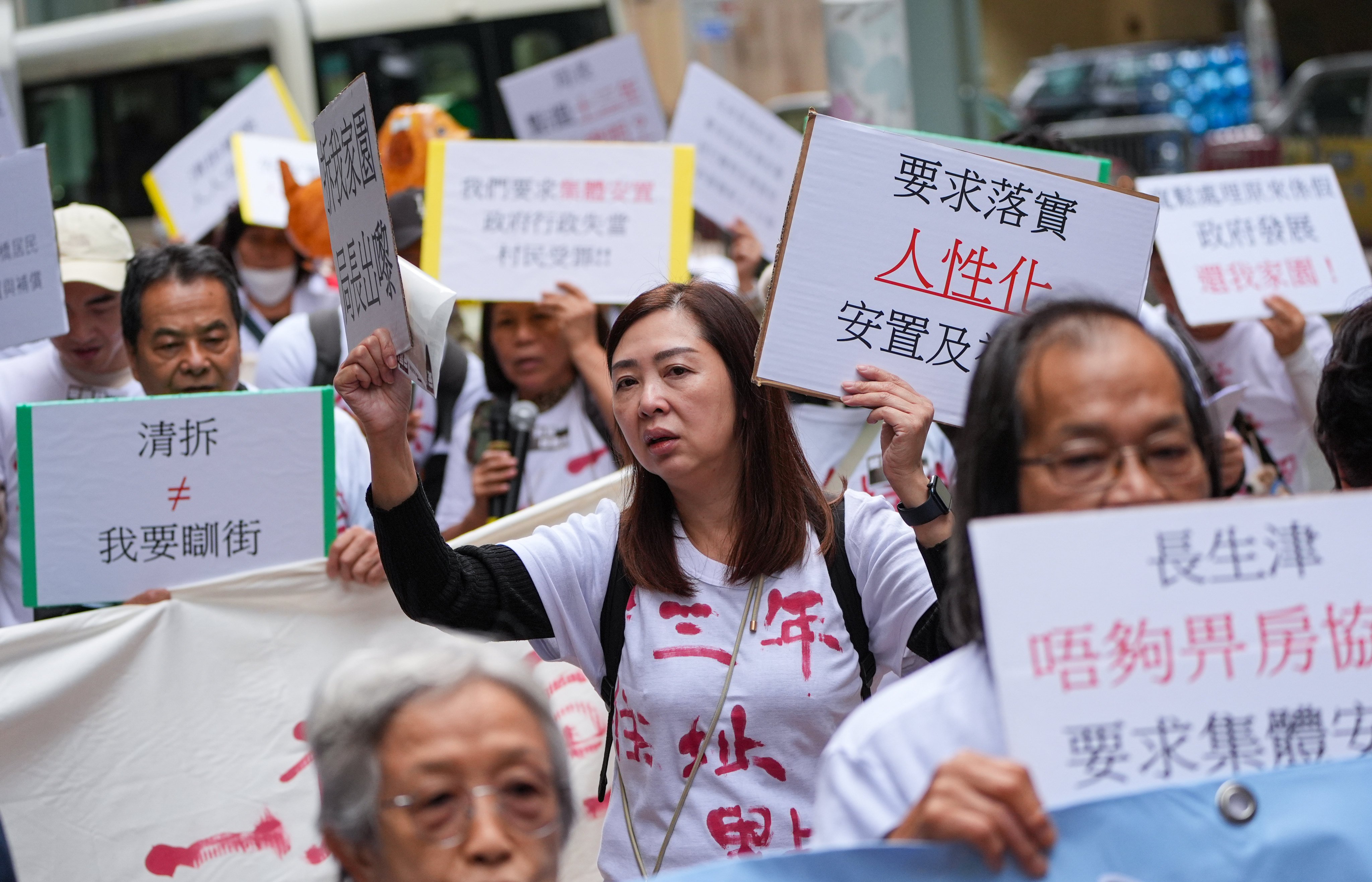 Villagers from the Hung Shui Kiu area near the border march in Admiralty on Sunday. Photo: Eugene Lee