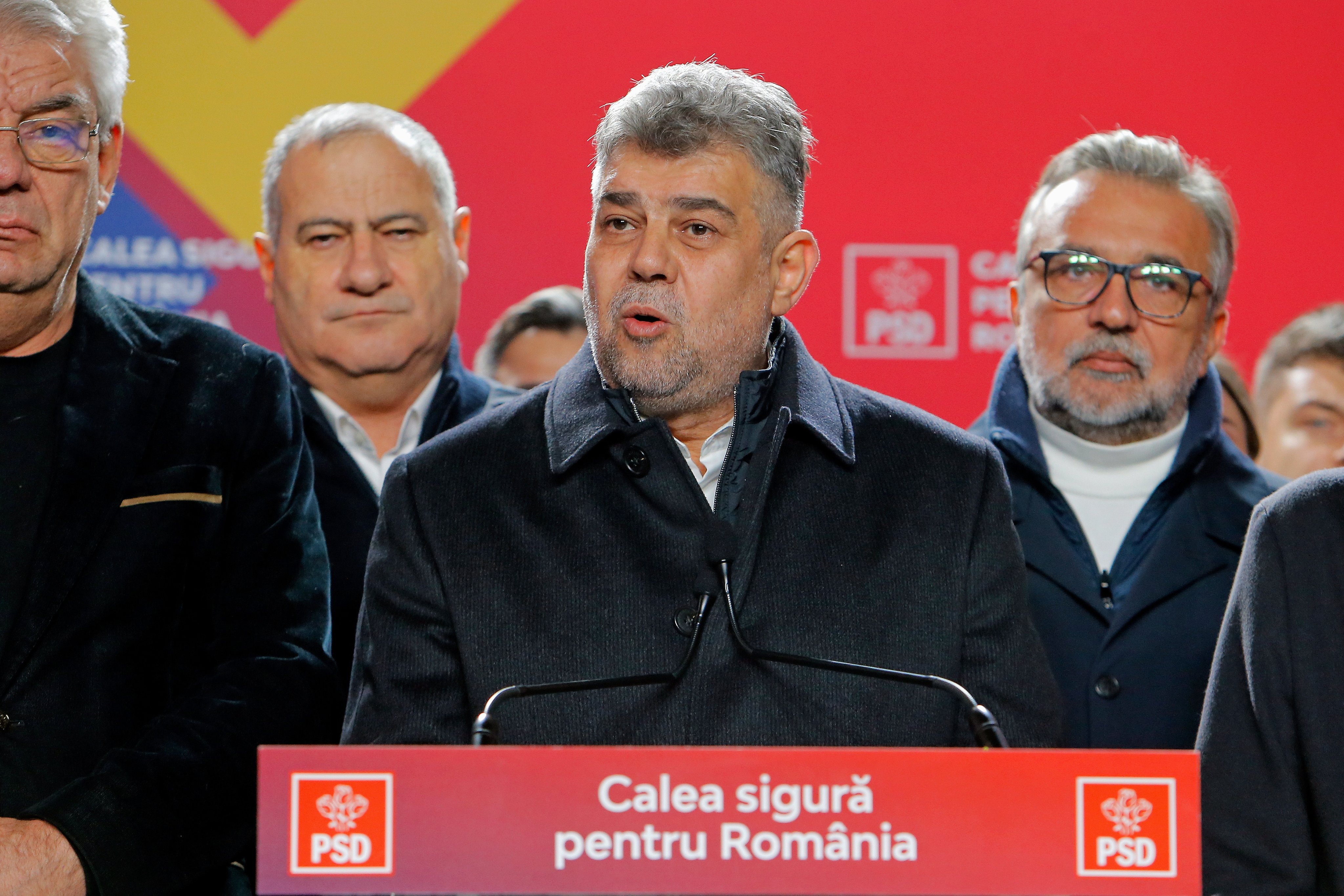 Romanian Prime Minister Marcel Ciolacu, centre, delivers a speech at the PSD campaign headquarters after the first exit-poll in Bucharest, Romania on Sunday. Photo: EPA-EFE