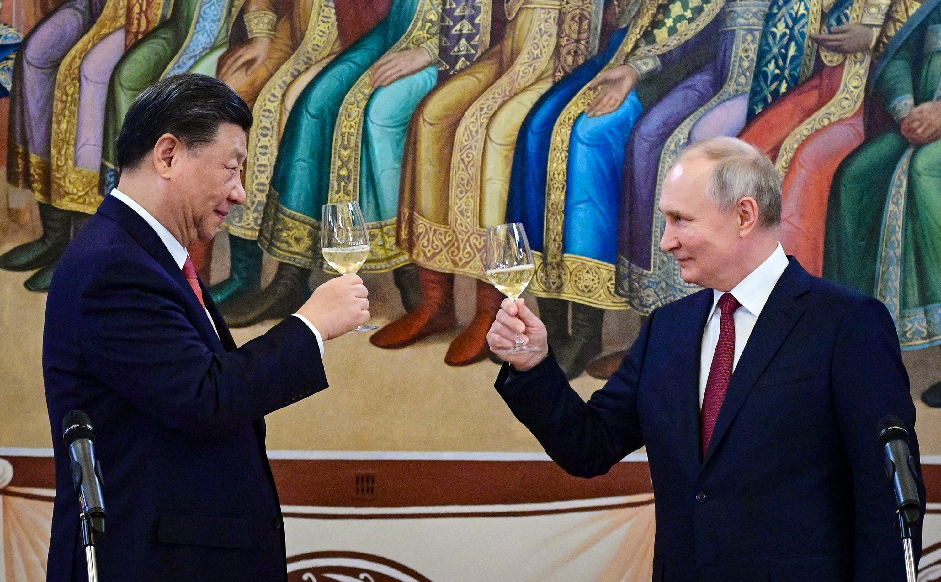 Presidents Xi Jinping and Vladimir Putin toast during a reception in Moscow following China-Russia talks in March 2023. Photo: TNS