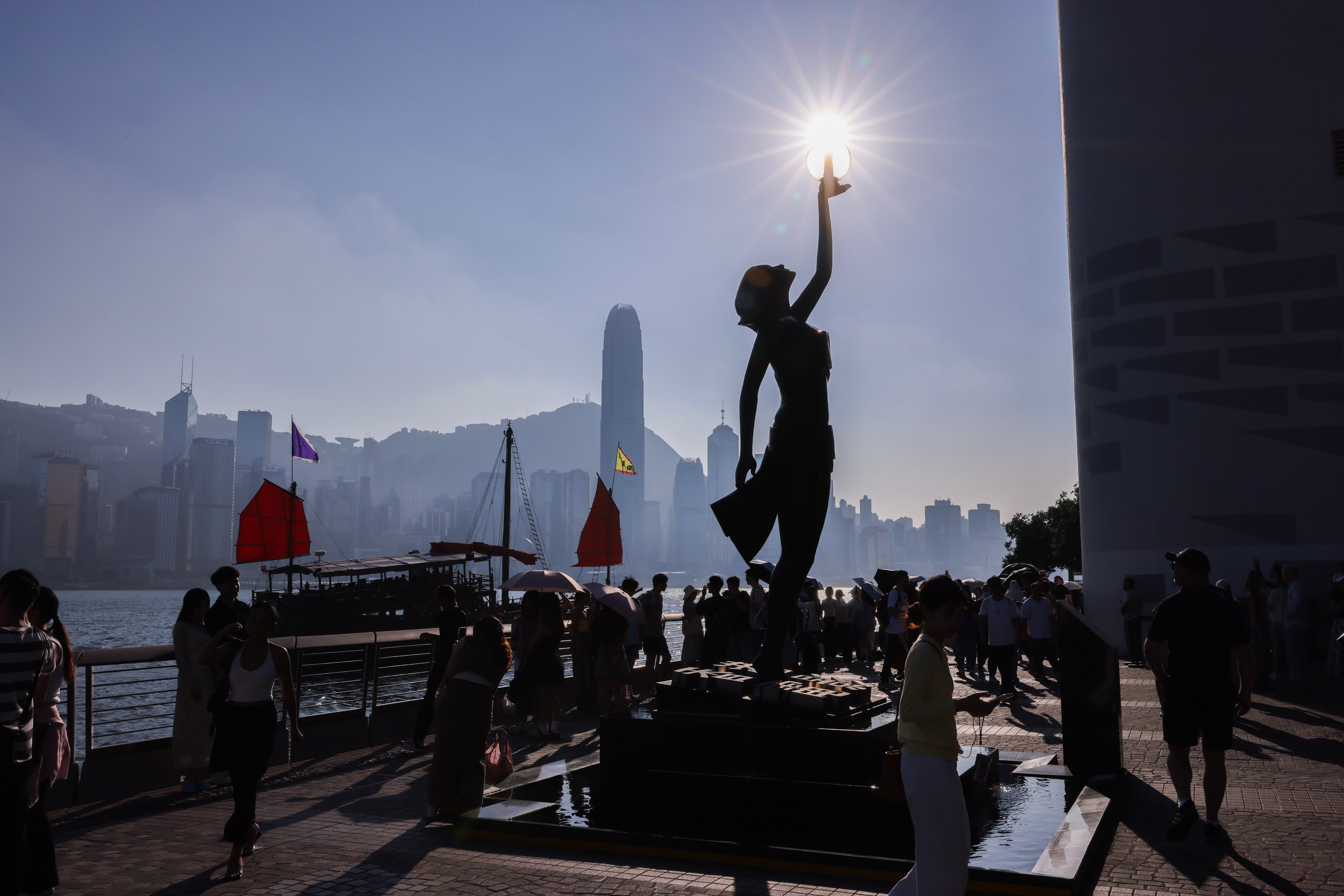 Visitors walk along the Tsim Sha Tsui promenade, on October 19. Photo: Nora Tam