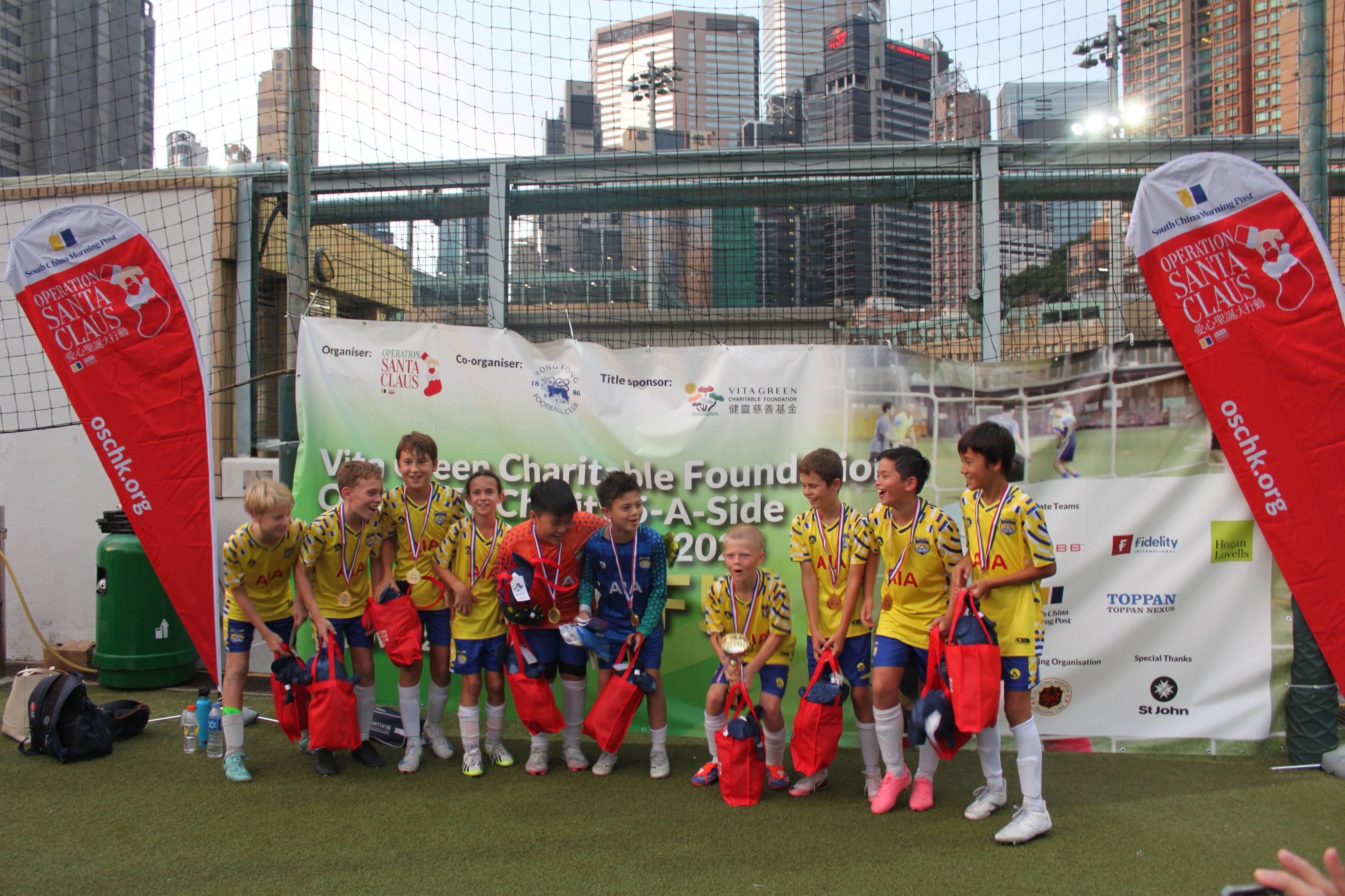 Winners of the junior tournament receive medals during the awards ceremony. Photo: Kriti Gandhi