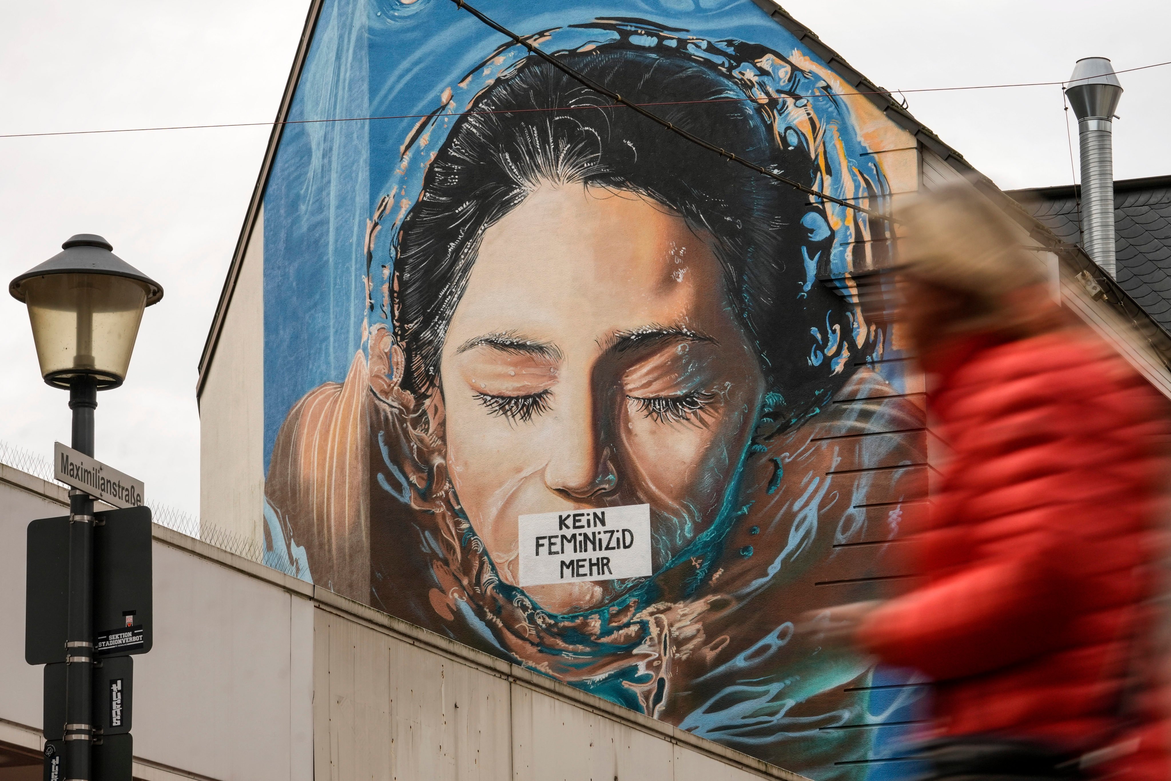 Graffiti, reading ‘no more feminicide’ is sprayed on the wall of a house in Gelsenkirchen, Germany. Photo: AP