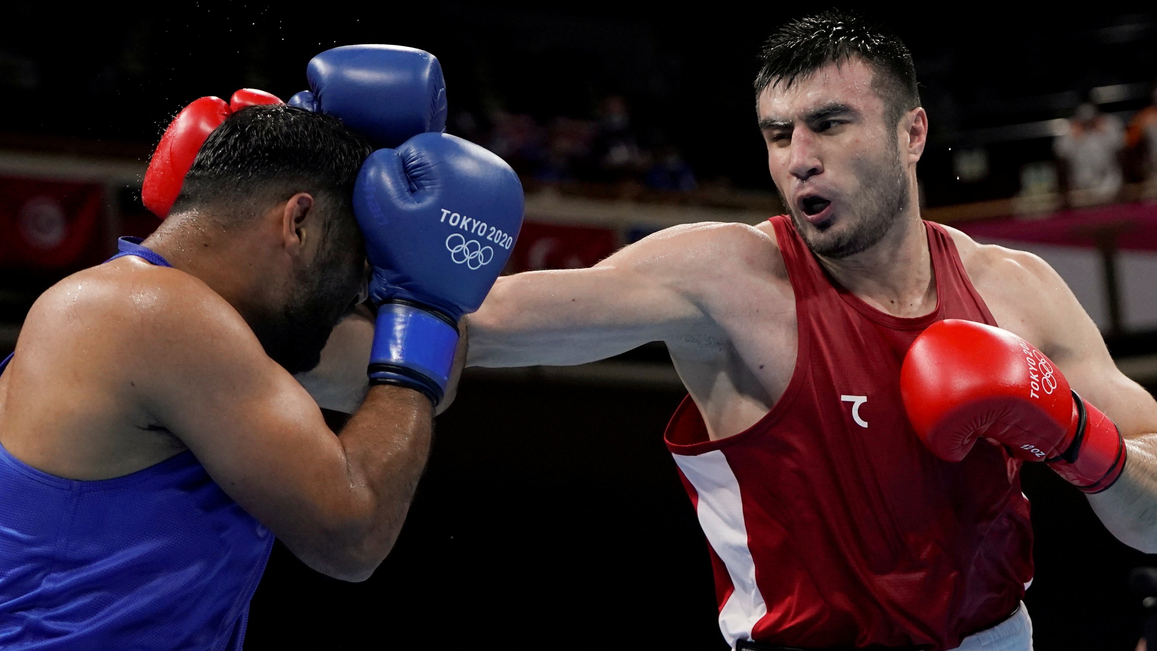 Bakhodir Jalolov of Uzbekistan (right) in action against India’s Satish Kumar at the Tokyo Olympics. Uzbekistan, one of the most successful Olympic boxing nations, has joined the new Asian body. Photo: Reuters