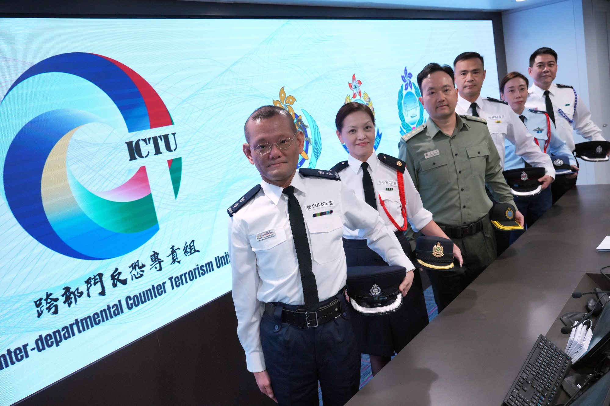 Police Senior Superintendent Peter Leung (left) says the force hopes to further expand its intelligence network under the three-tier prevention mechanism in the future. Photo: May Tse