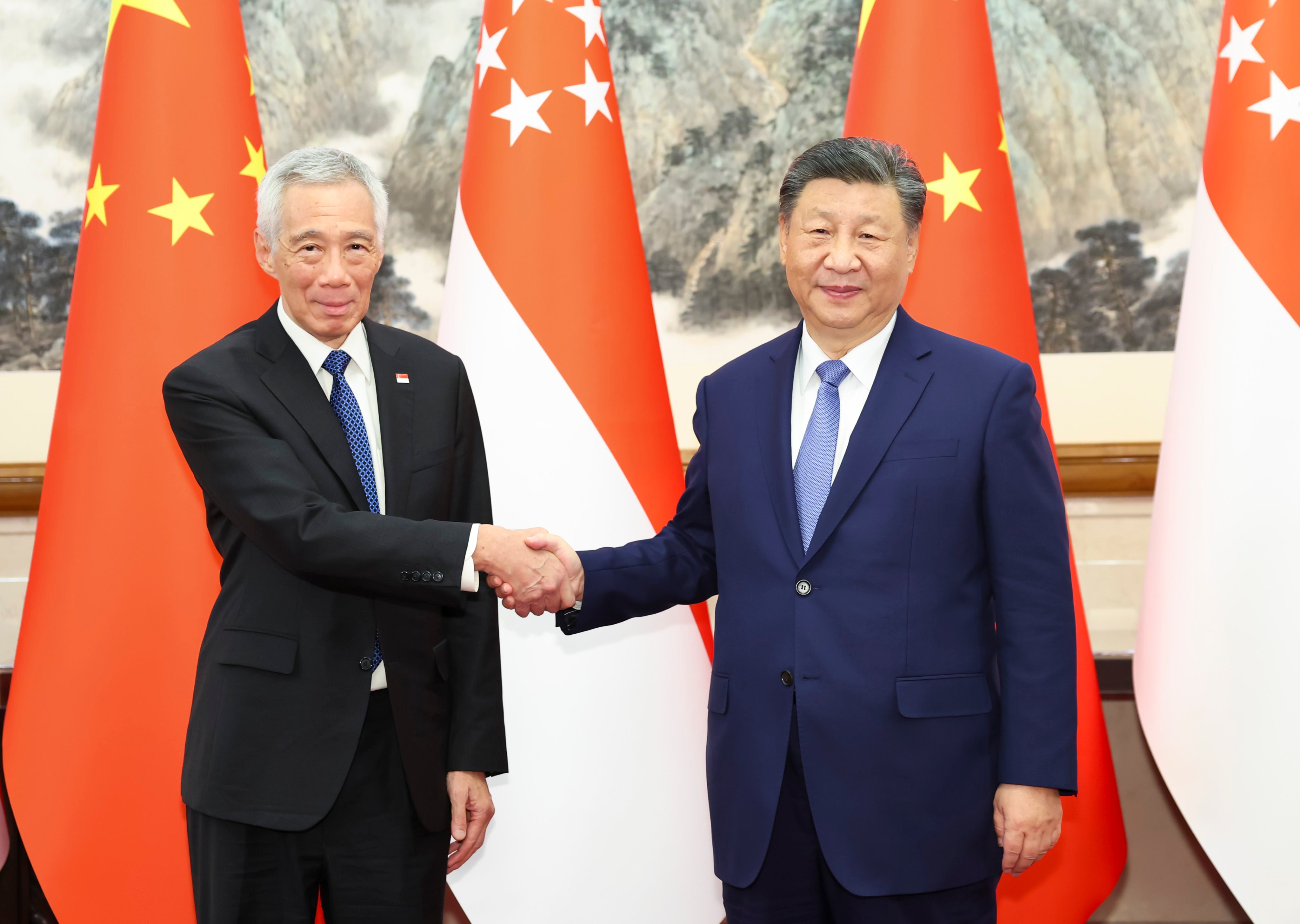 Lee Hsien Loong met Xi Jinping during his first visit to China since stepping down as prime minister. Photo: Xinhua