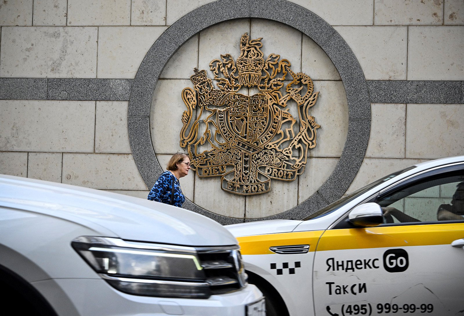 A woman walks outside the British embassy building in Moscow. Photo: TNS