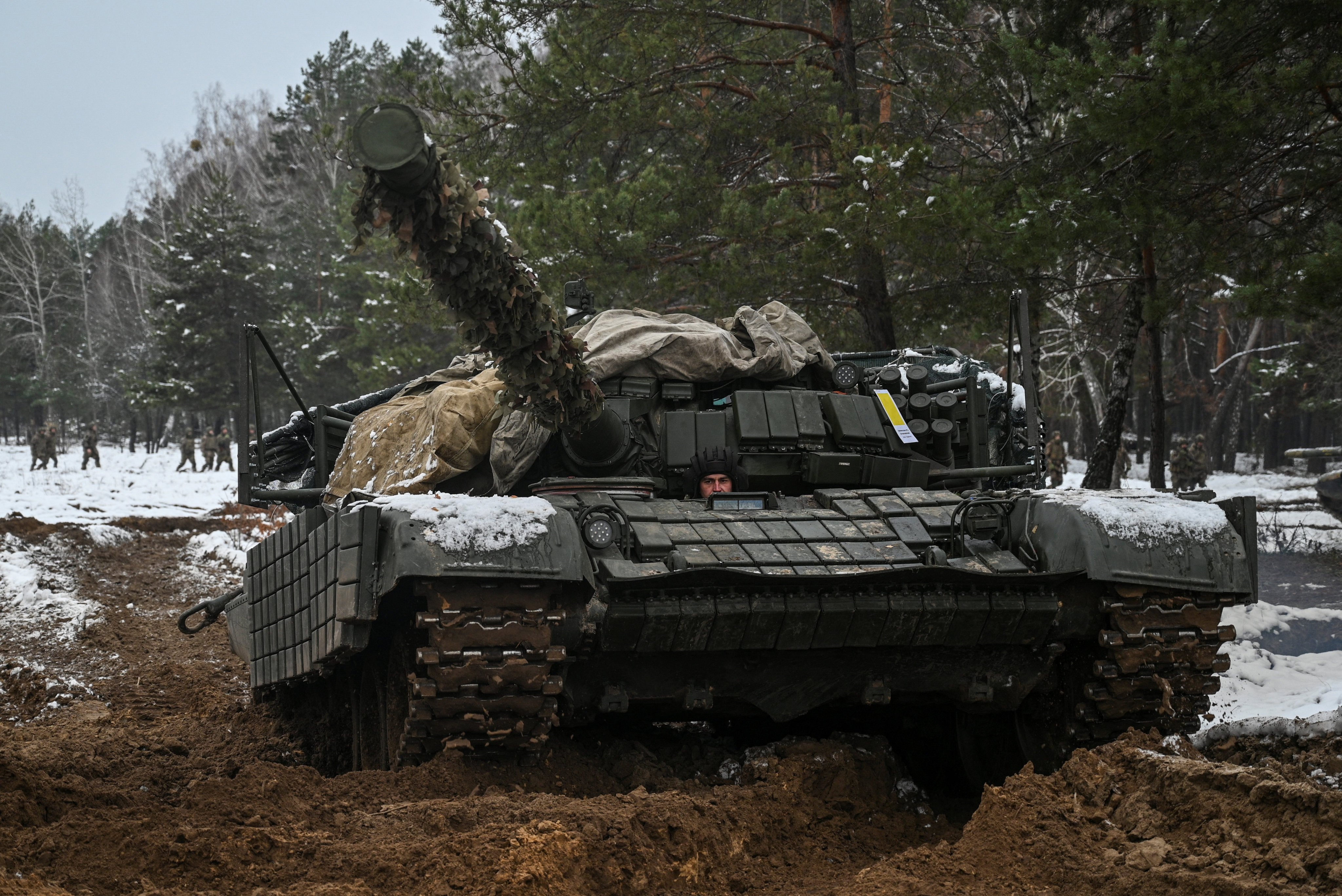 A Ukrainian soldier drives a tank during military drills at a training ground in Chernihiv region, Ukraine, on November 22. Photo: Reuters