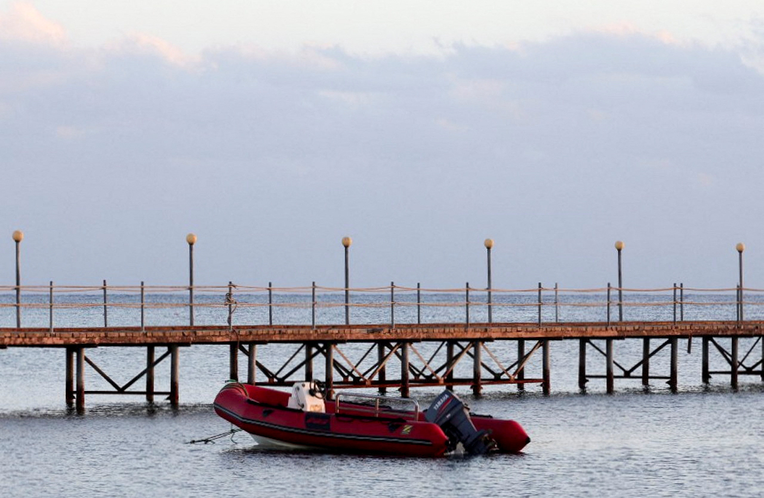 A boat is docked near the beach where survivors from the boat that capsized off Egypt’s Red Sea coast were brought, in Marsa Alam, Egypt on November 26. Photo: Reuters