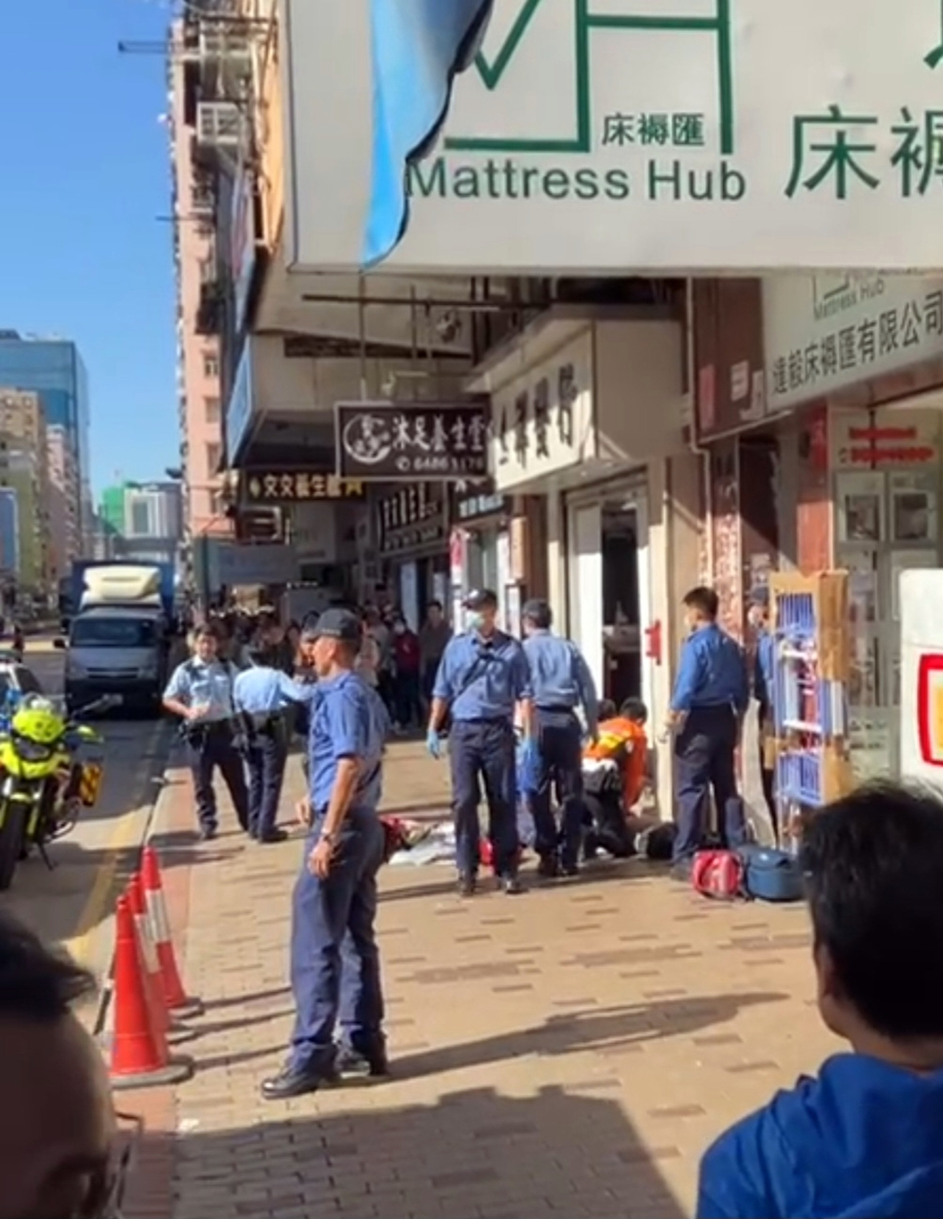 Emergency services personnel treat the man found on the roadside. Photo: Handout