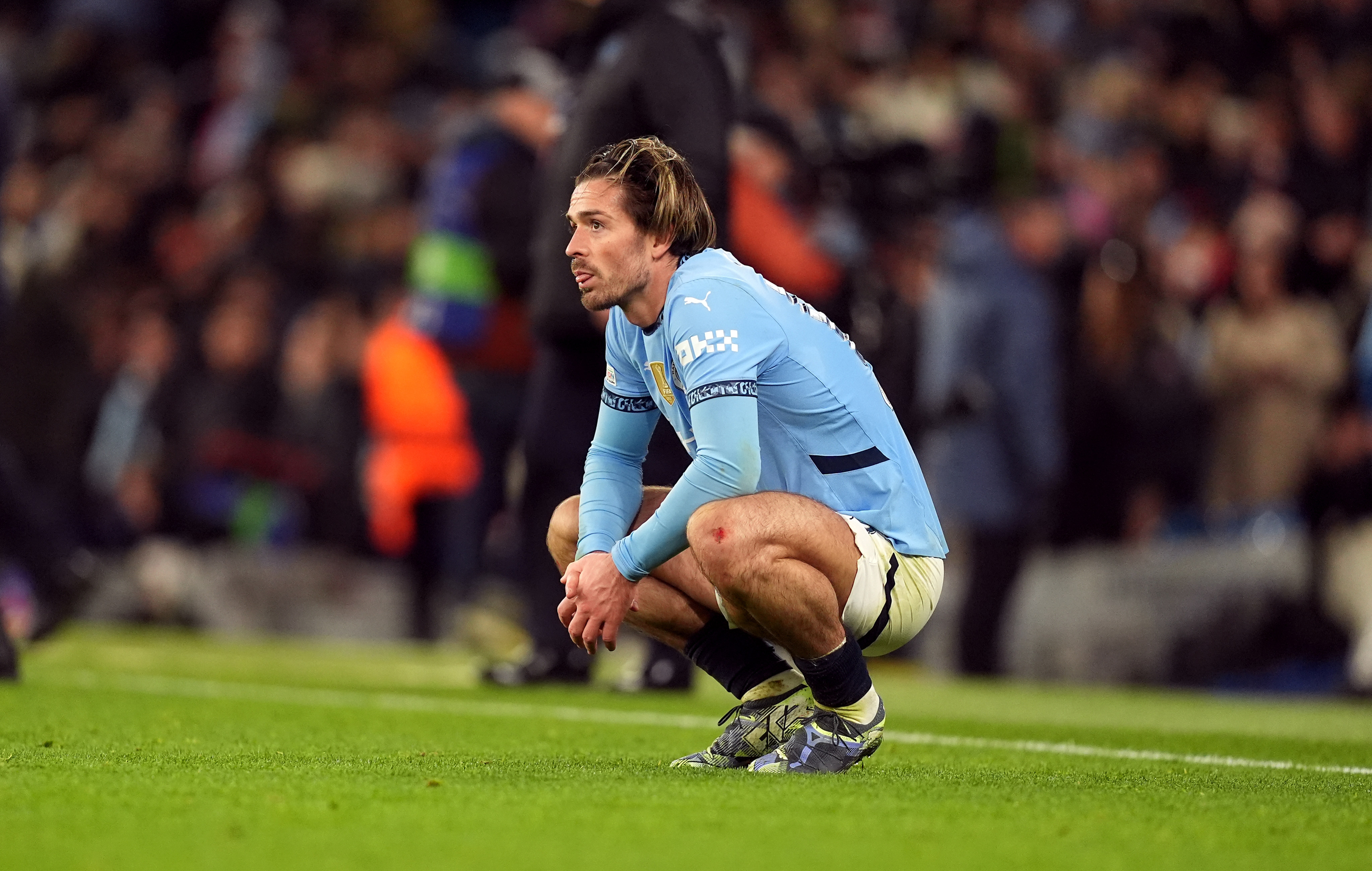 Manchester City’s Jack Grealish cut a dejected figure after the final whistle at the Etihad Stadium. Photo: DPA