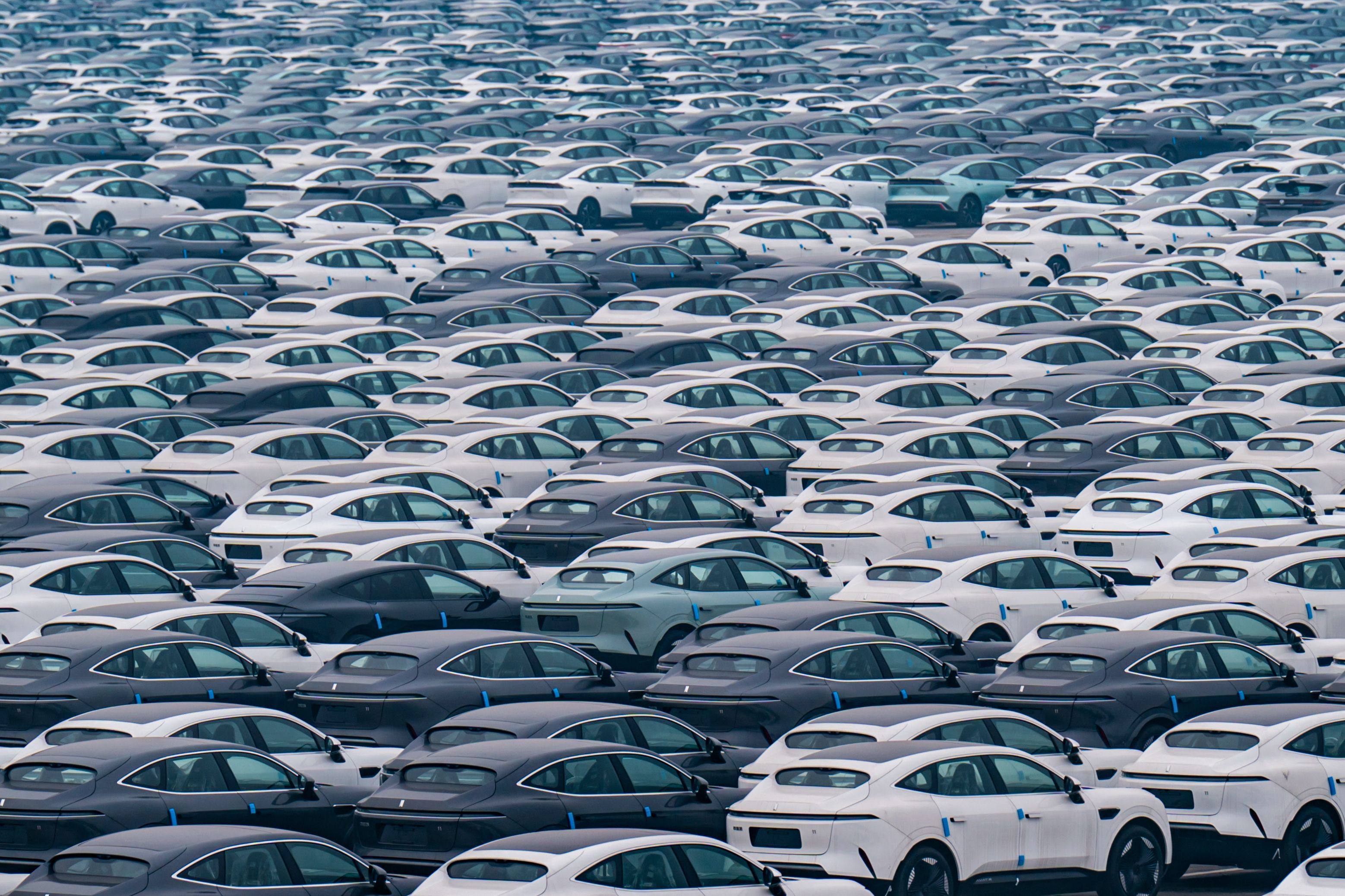 New energy vehicles are parked at a Changan Automobile distribution centre, in Chongqing, on January 14. A unified national market in China might mean less protectionism and less wastage in, for example, the electric vehicle sector. Photo: AFP