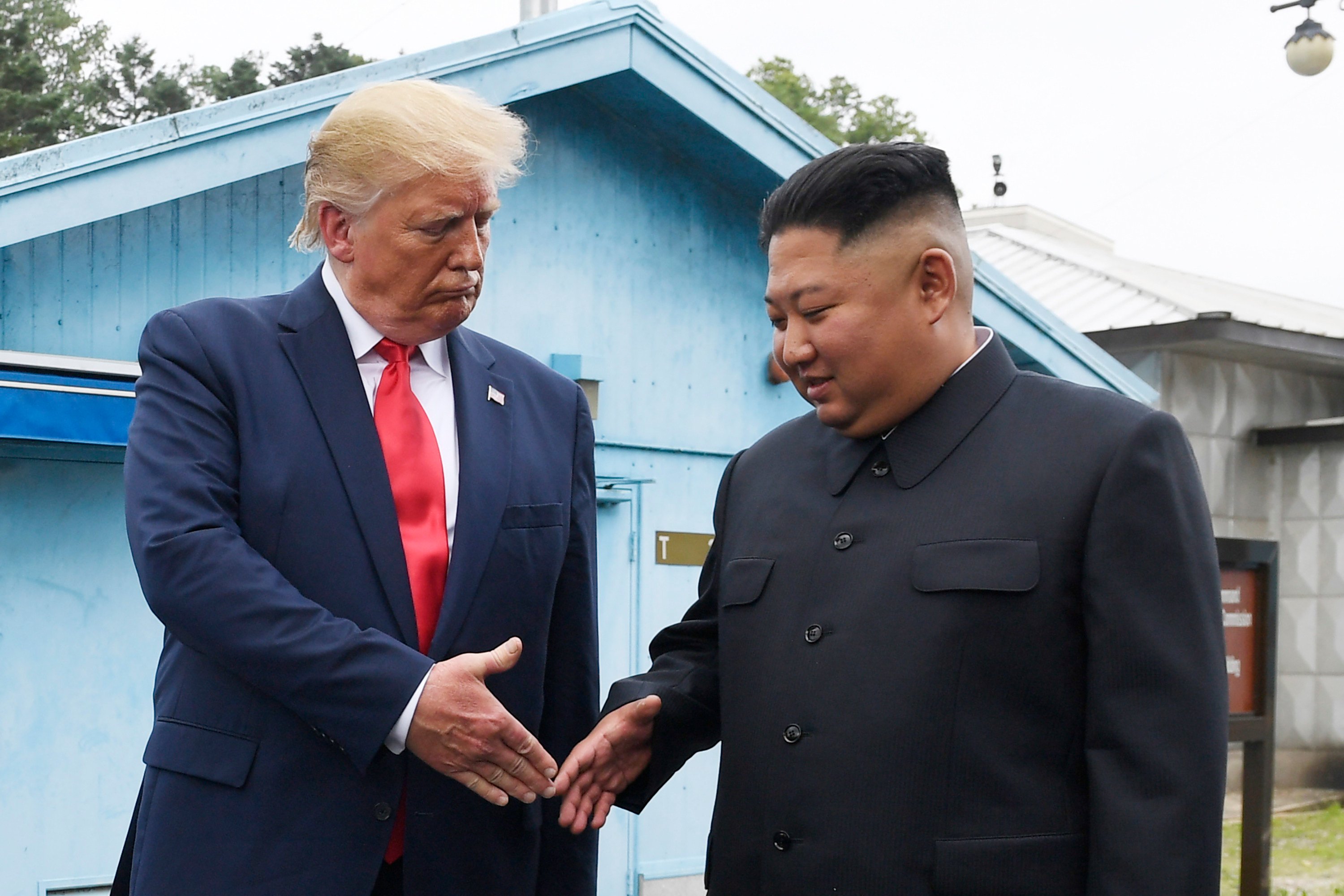 North Korean leader Kim Jong-un and US President Donald Trump prepare to shake hands at the border village of Panmunjom in the demilitarised zone, South Korea, in June 2019. Photo: AP