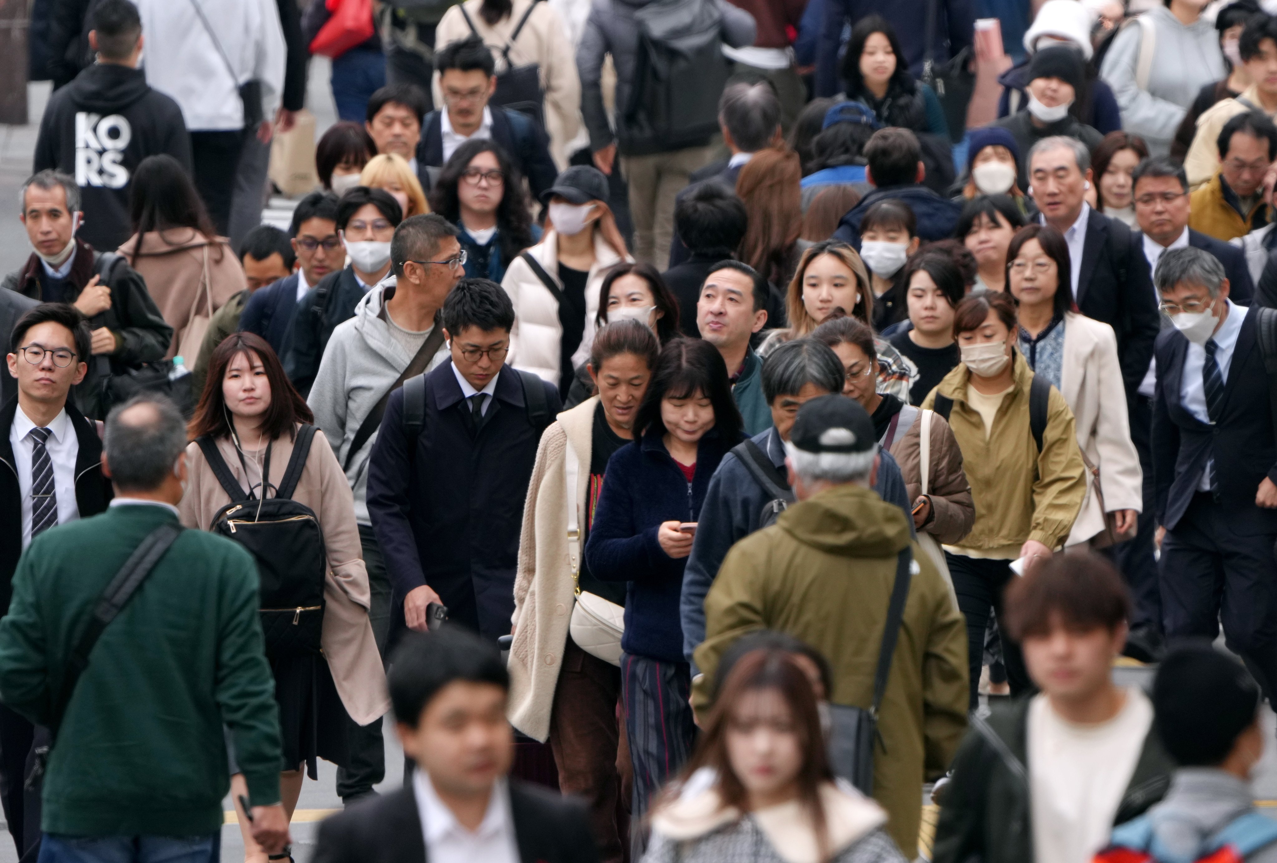 Pedestrians walking down a Shinjuku street in Tokyo, Japan. Photo: EPA-EFE