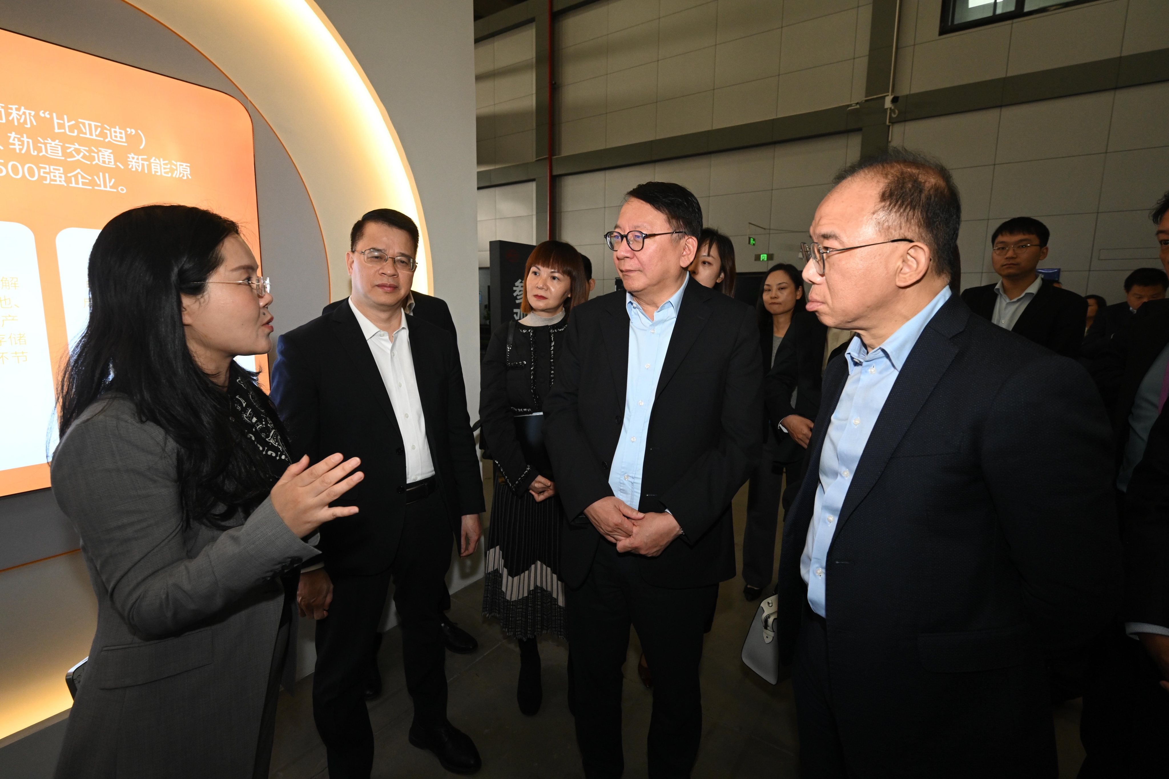 Chief Secretary Eric Chan (second from right) tours the factory of Chinese electric vehicle manufacturer BYD in Shenzhen. Photo: SCMP