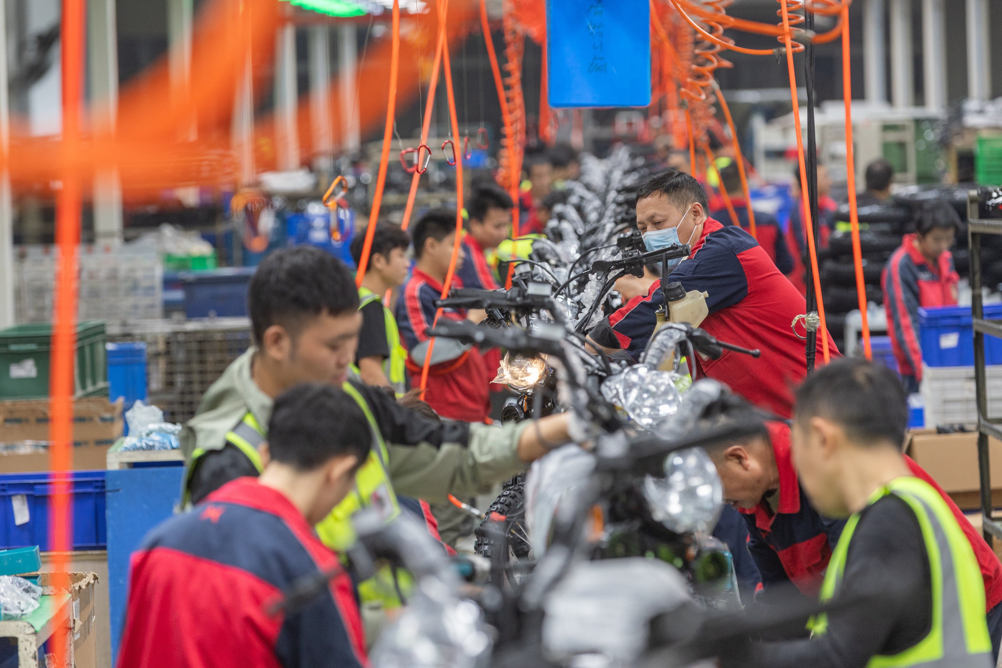 Employees work on a motorcycle assembly line in Chongqing on November 13. Chinese manufacturers hoping to export goods to the US are bracing for higher tariffs with the return of Donald Trump to the White House. Photo: Xinhua