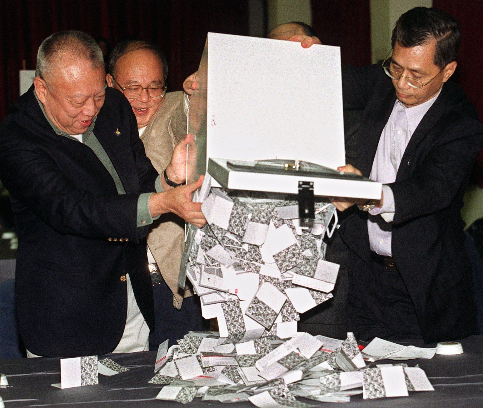 Tung Chee-hwa (far left) opens ballot boxes in Causeway Bay Counting Centre on November 28, 1999. Photo: K. Y. Cheng