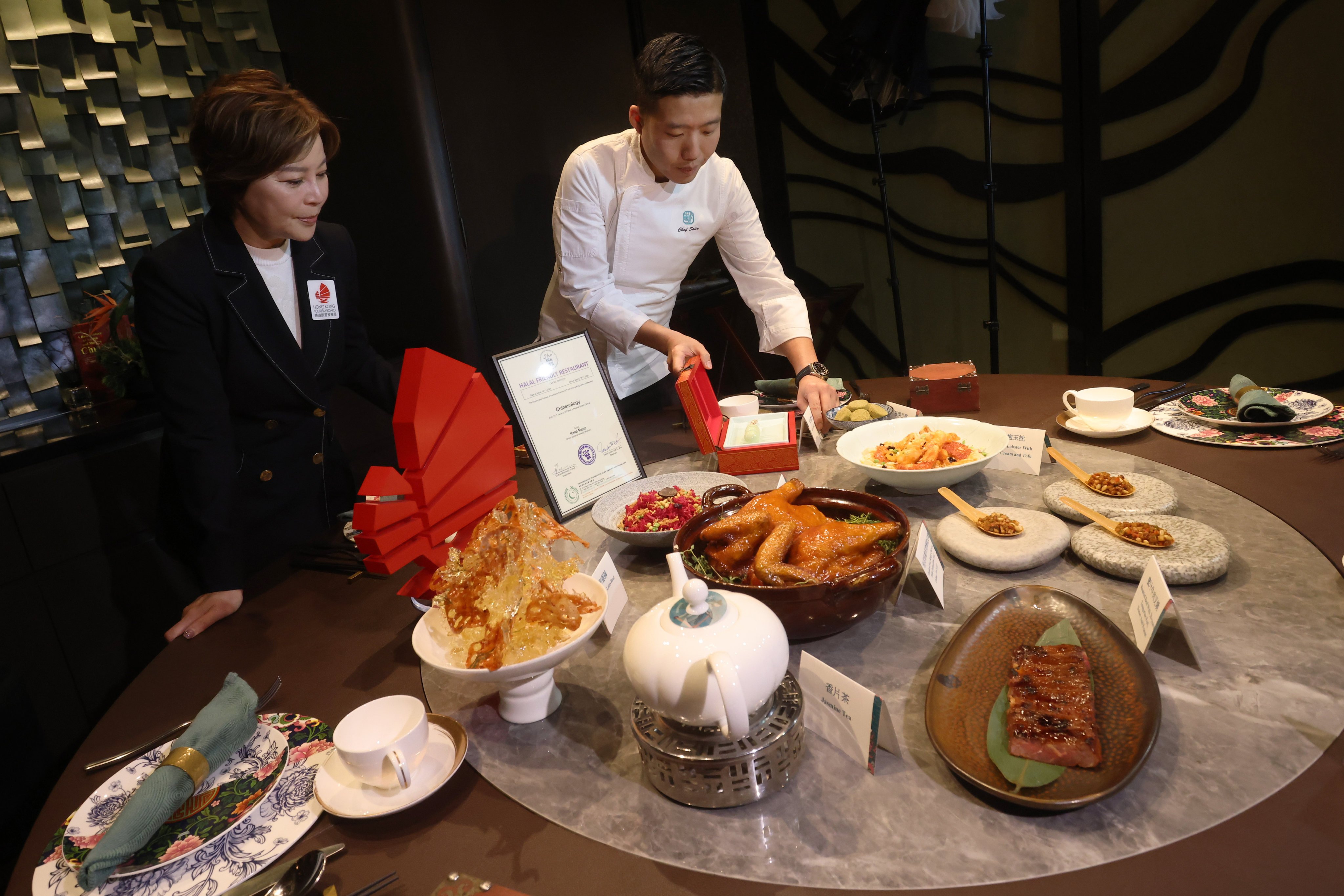 Tourism Board Deputy Executive Director Becky Ip and Chinesology’s Saito Chau with its halal-friendly cuisine. Photo: Jonathan Wong